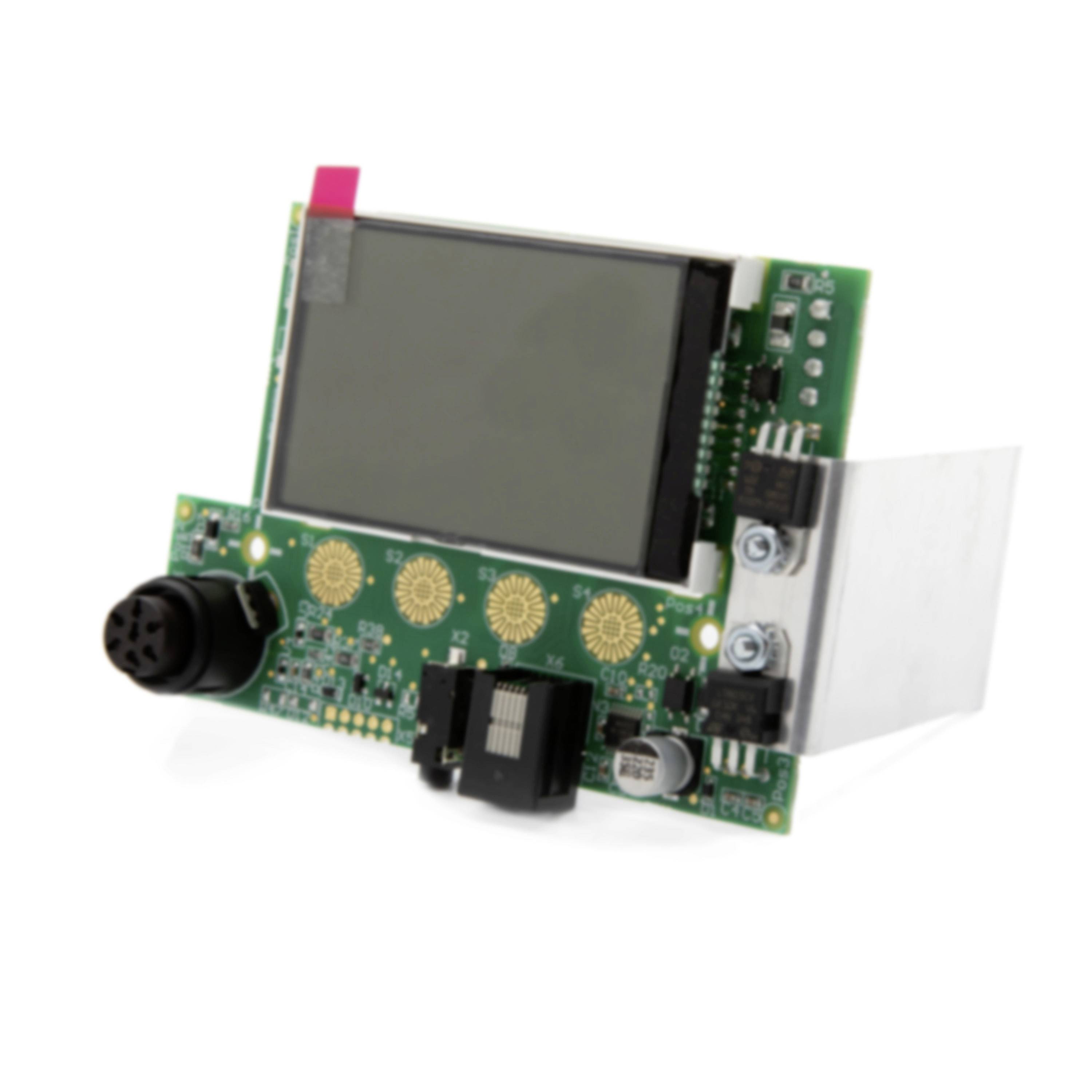 Electronic circuit board with a small display screen, connector ports, and mounted components on a white background.