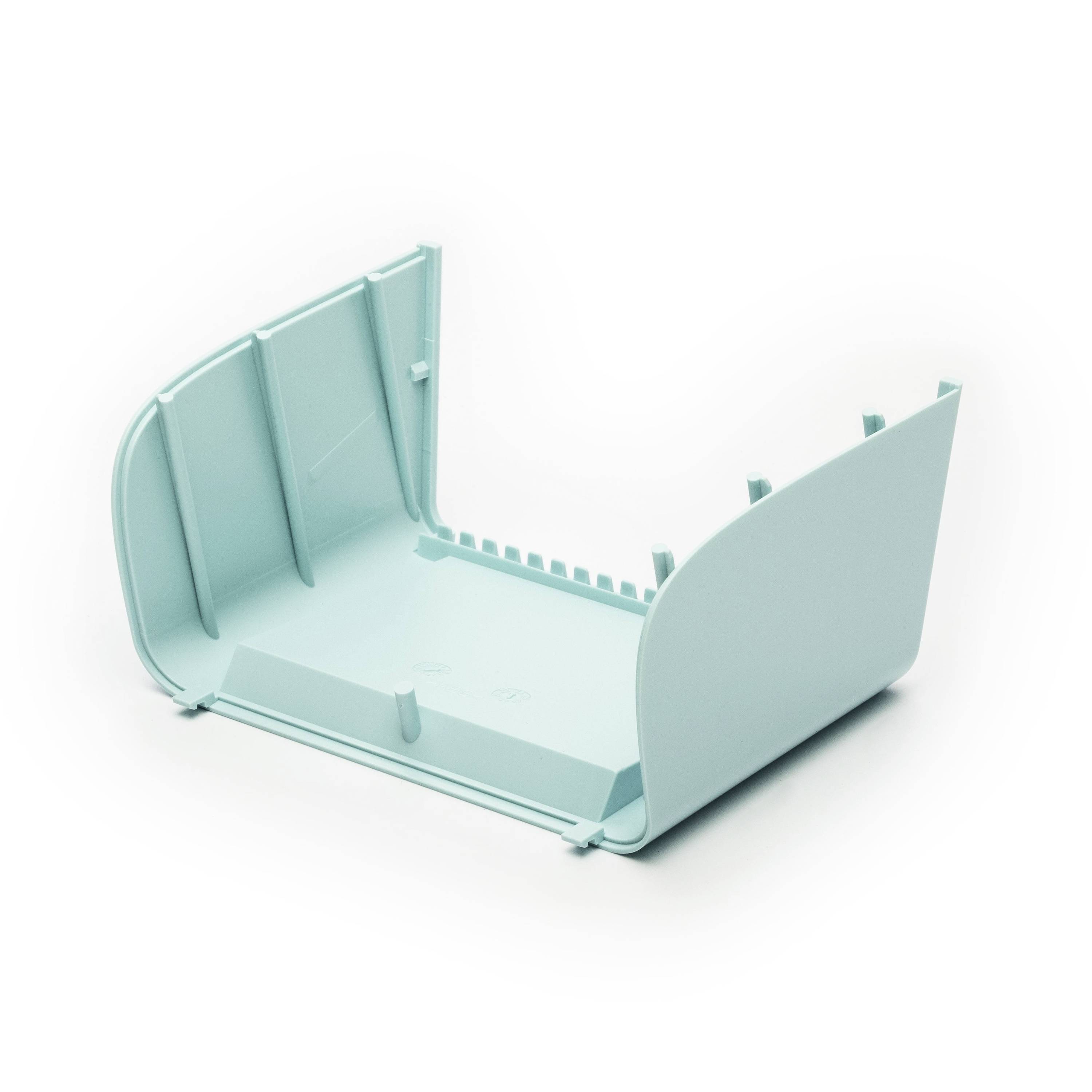 Empty light teal plastic tray or housing component shown open on a white background.