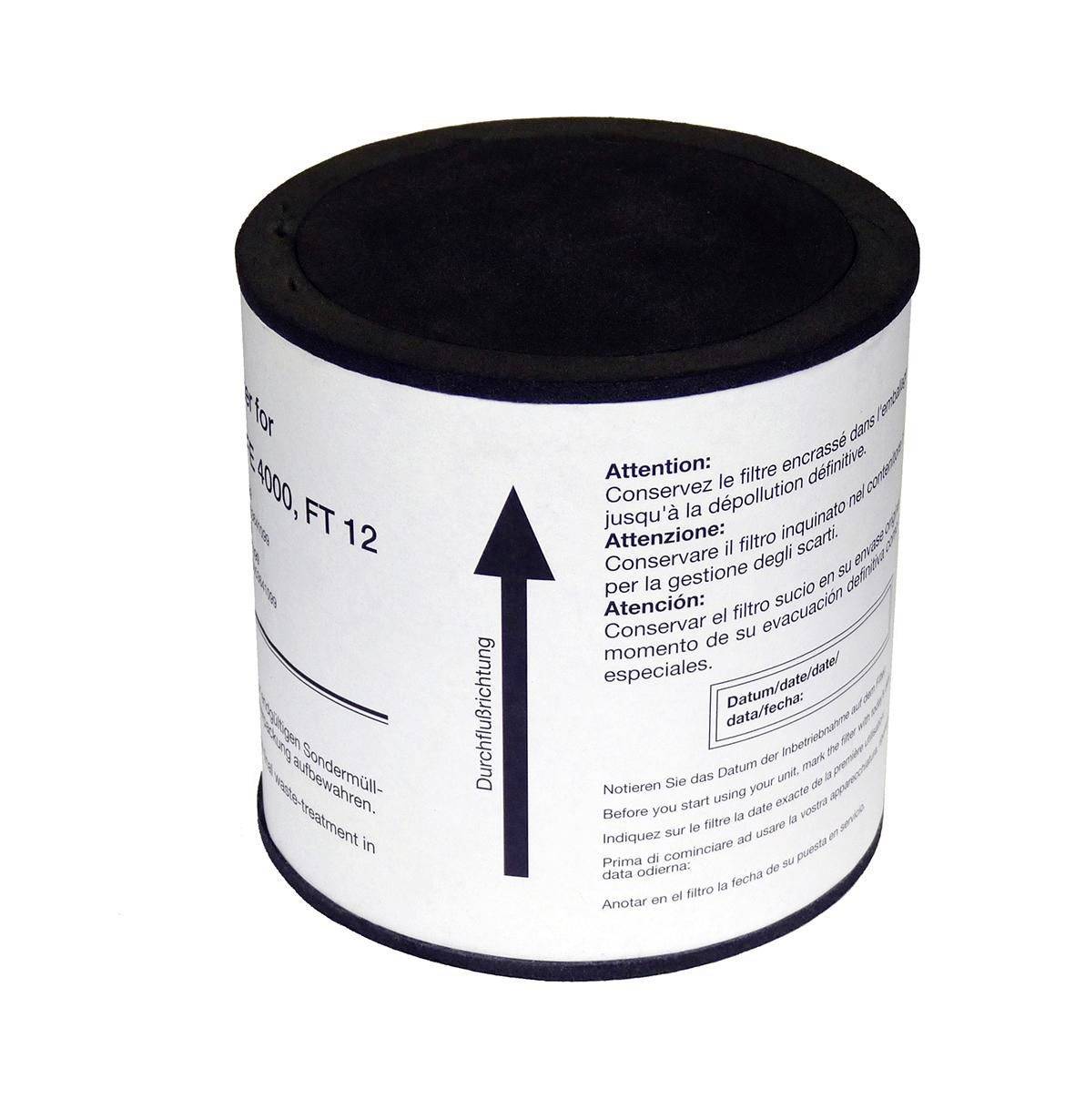 Cylindrical white filter cartridge with a black top, labeled with an upward arrow and multilingual warning text.