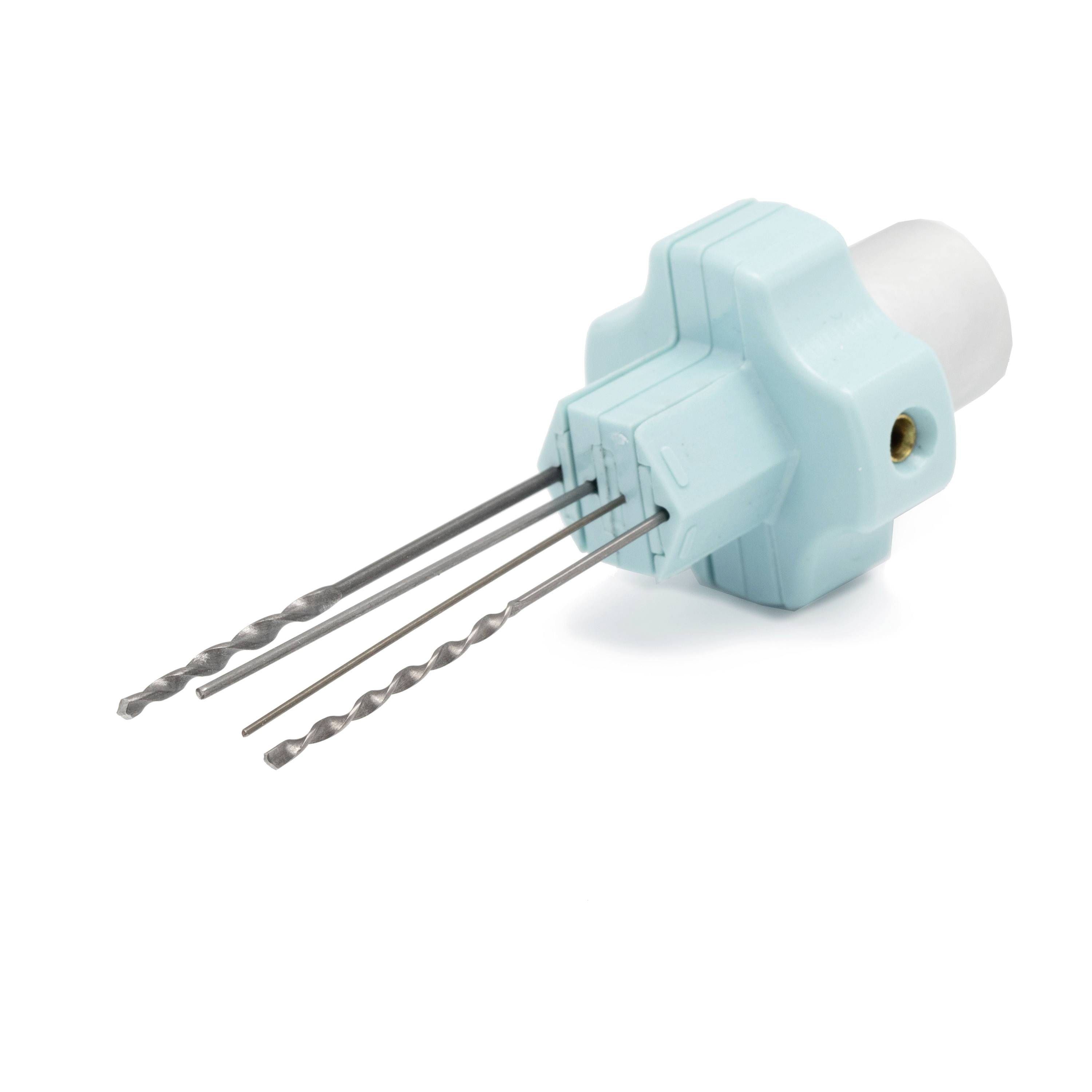 A turquoise plastic drill guide with three metal drill bits protruding from it on a white background.