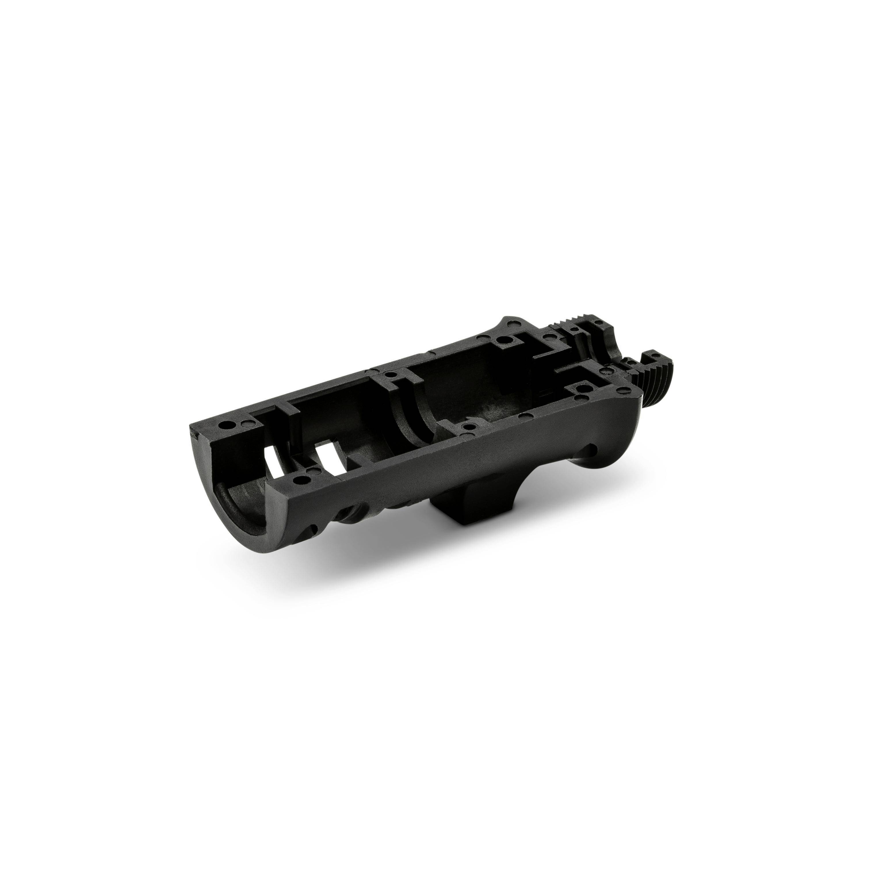 Black machined firearm receiver or lower housing component shown isolated on a white background.