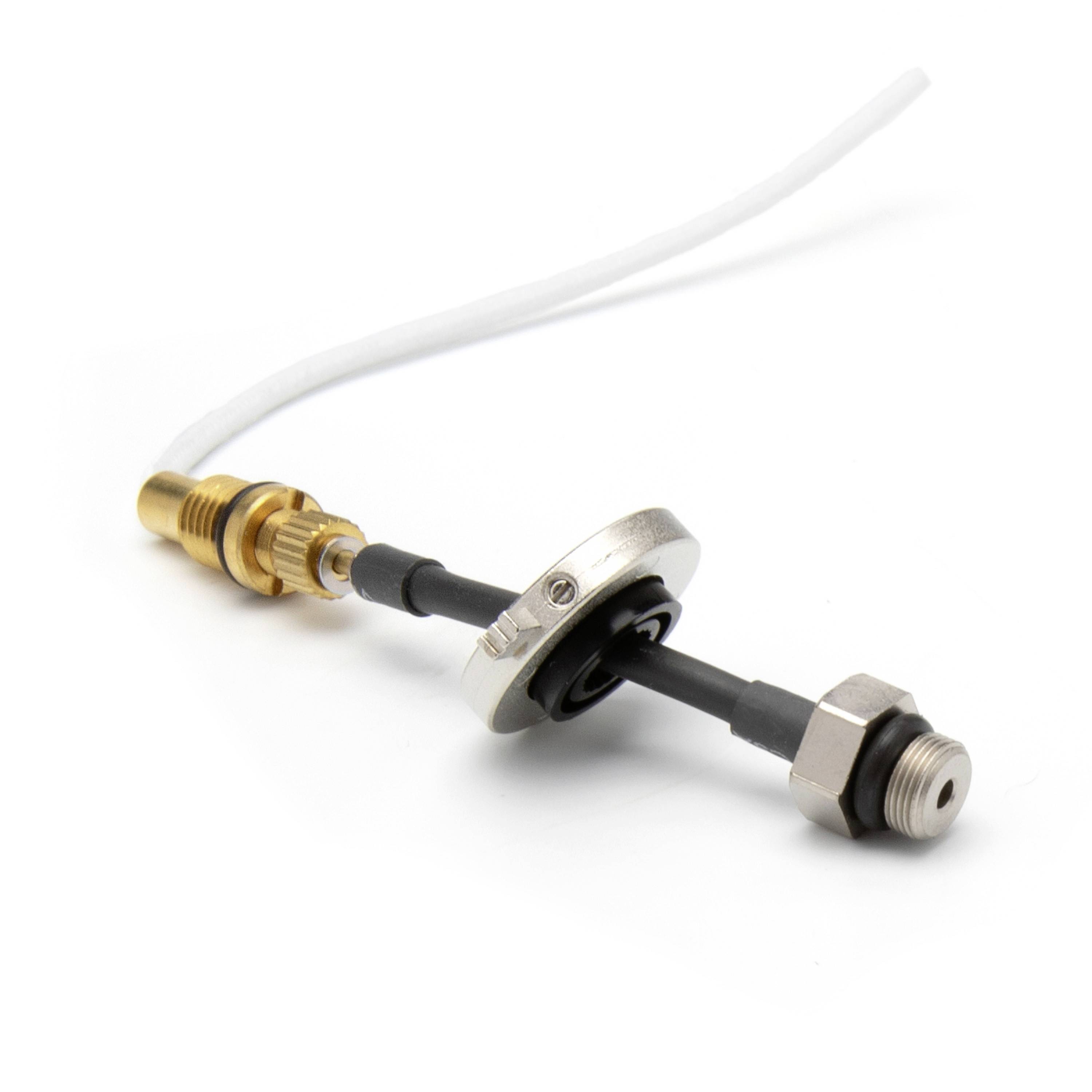 Close-up of a valve stem with a black rubber seal, metal mounting ring, and threaded brass fittings on a white background.