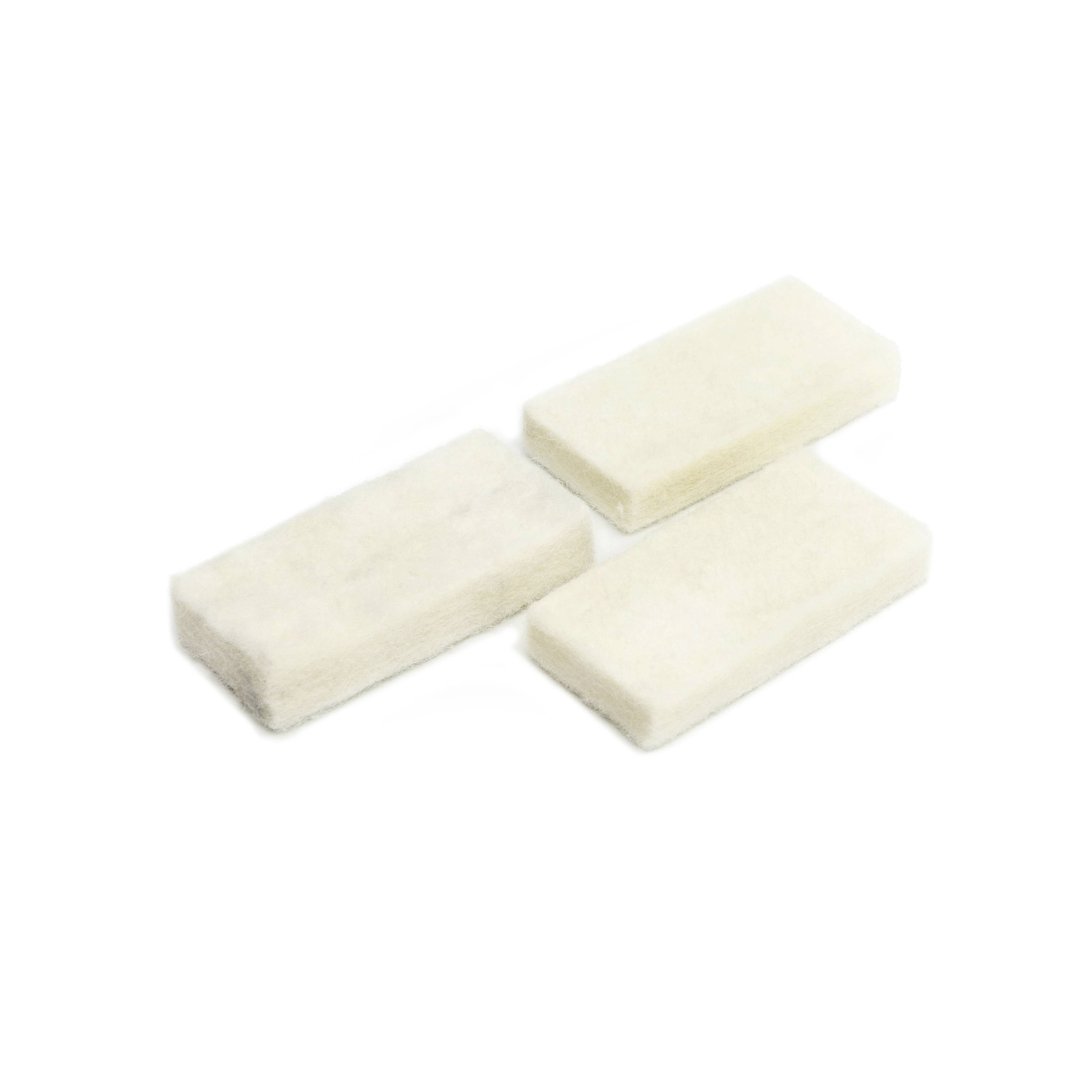 Three white rectangular foam blocks arranged diagonally on a plain white background.
