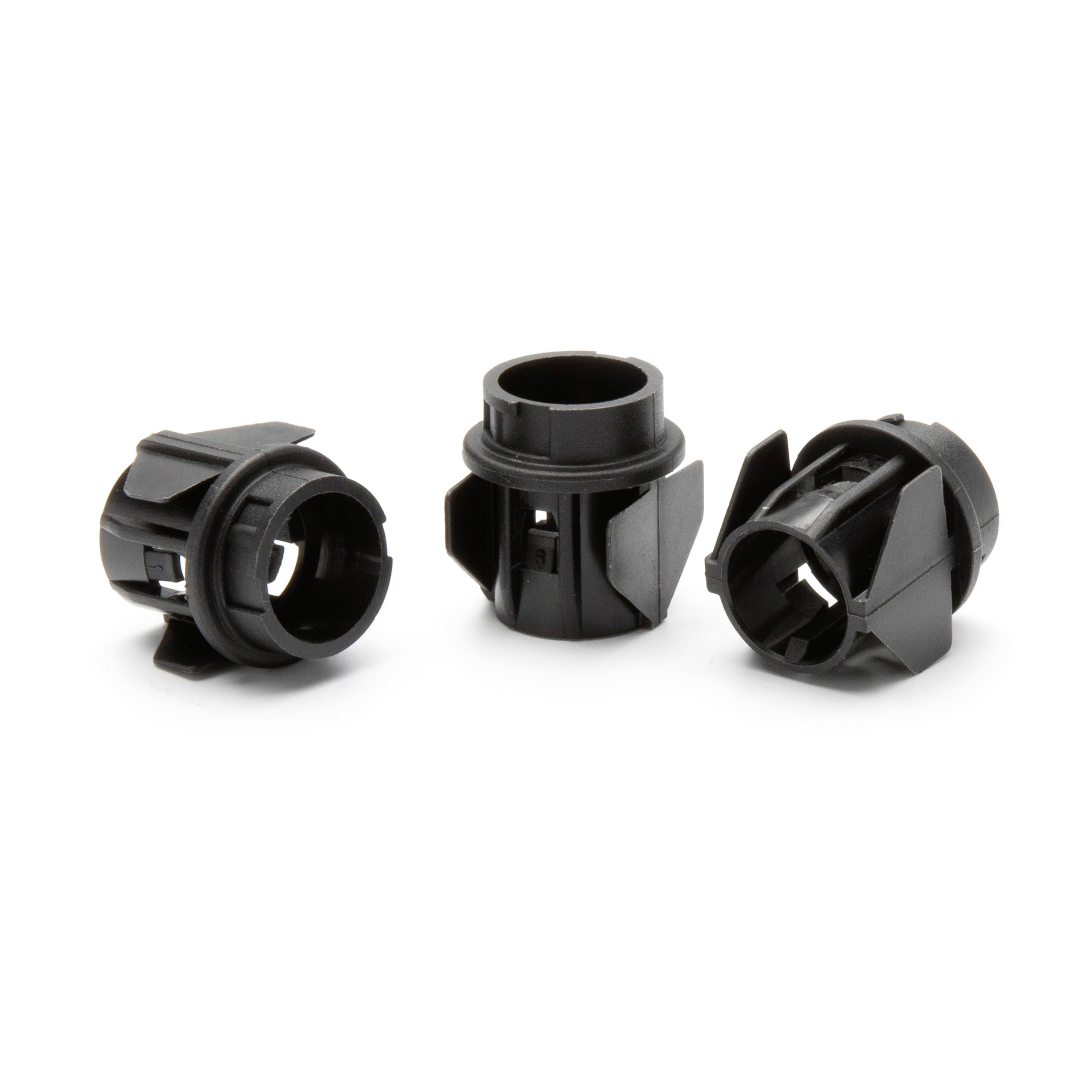 Three black plastic cylindrical connector parts shown on a white background.