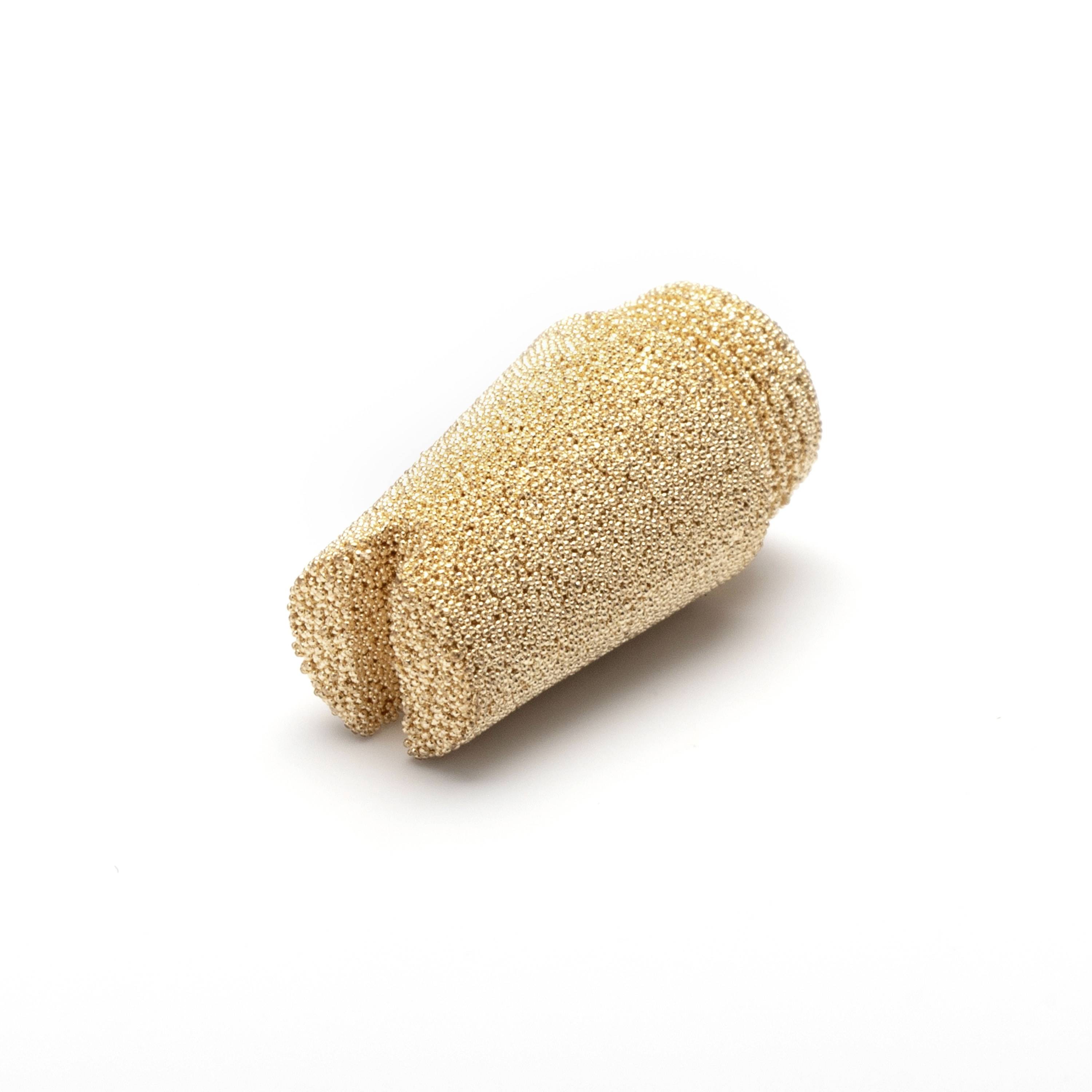 A beige textured cylindrical bread roll or pastry on a white background, shown at an angle with one end open.