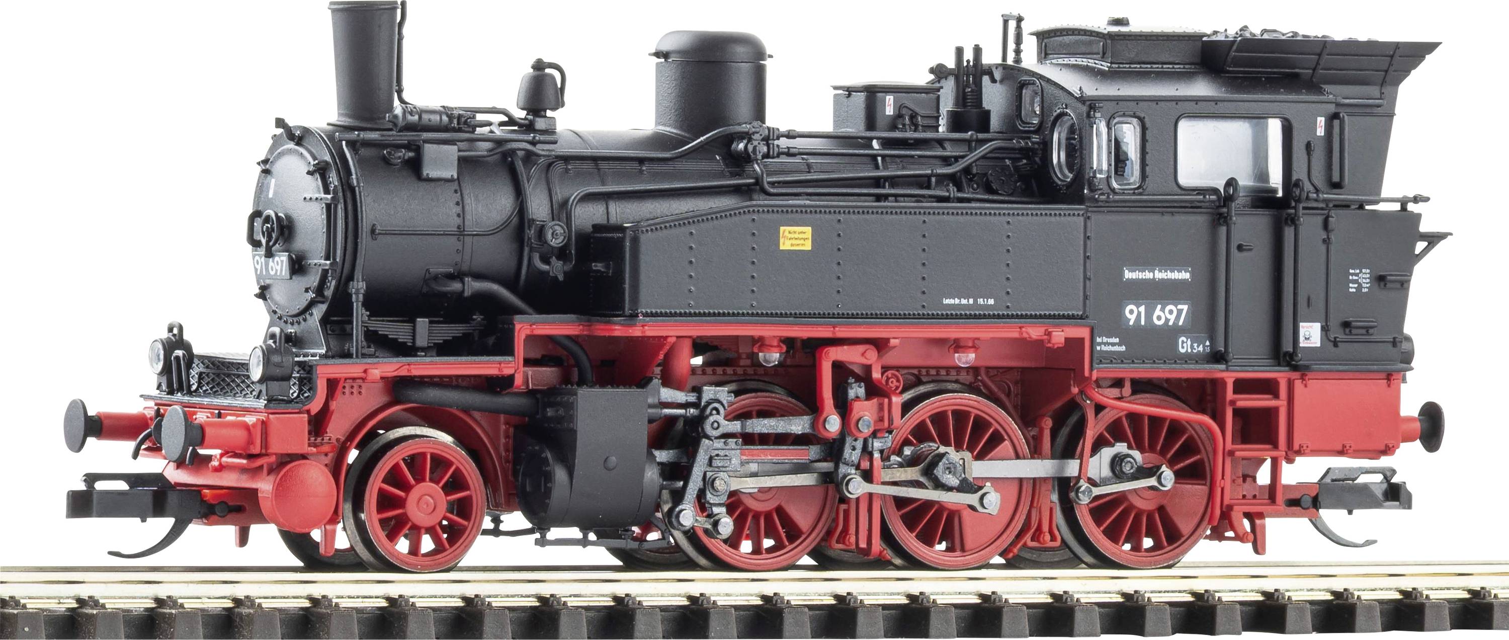 Modèle de locomotive à vapeur noire et rouge sur rails, vue de côté, avec roues visibles et cabine marquée « 91 697 ».
