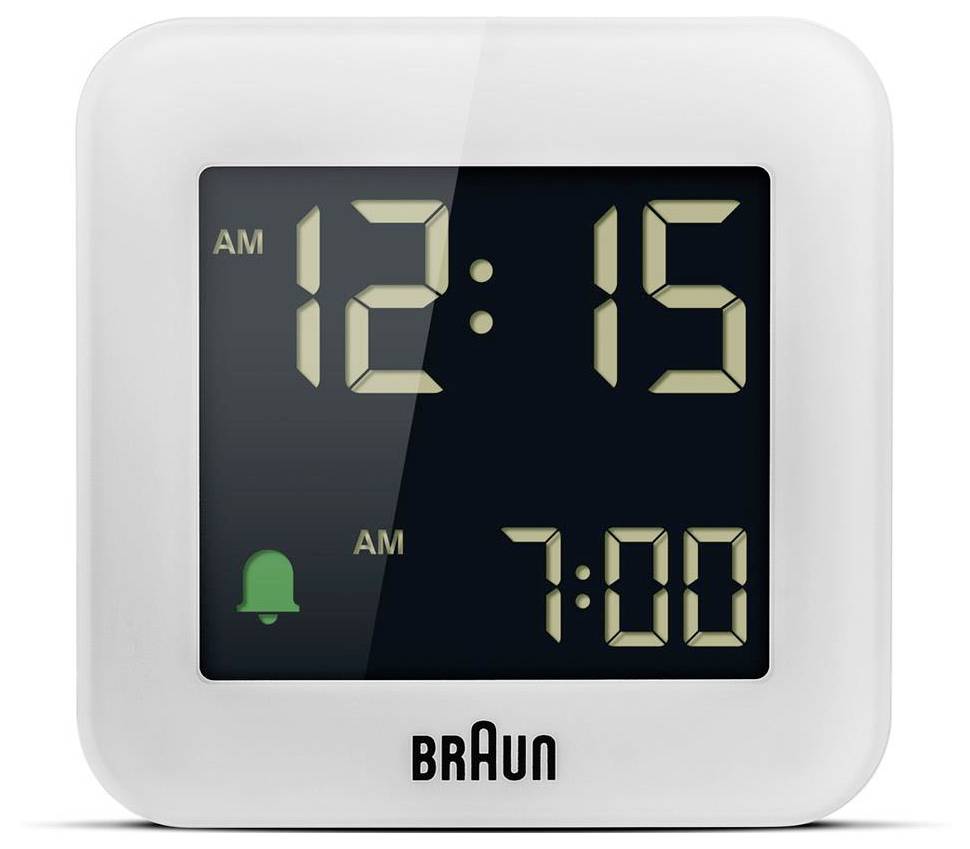 Horloge numérique carrée Braun affichant 12h15 avec une icône d'alarme verte et une deuxième alarme réglée sur 7h00.