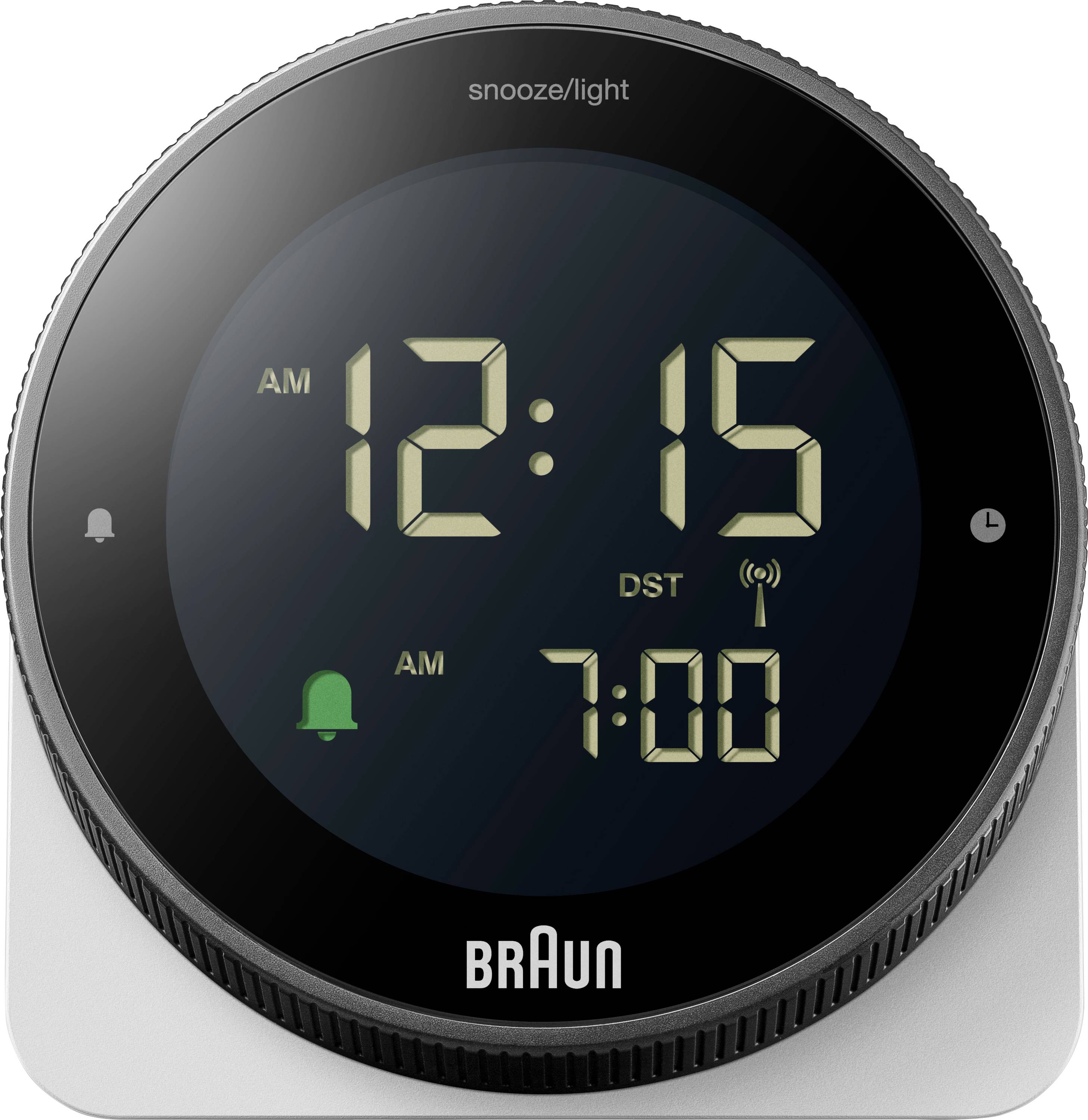 Réveil numérique rond Braun sur une base argentée, affichant 12h15 du matin avec une deuxième alarme réglée pour 7h00 du matin et un indicateur de changement d'heure d'été.