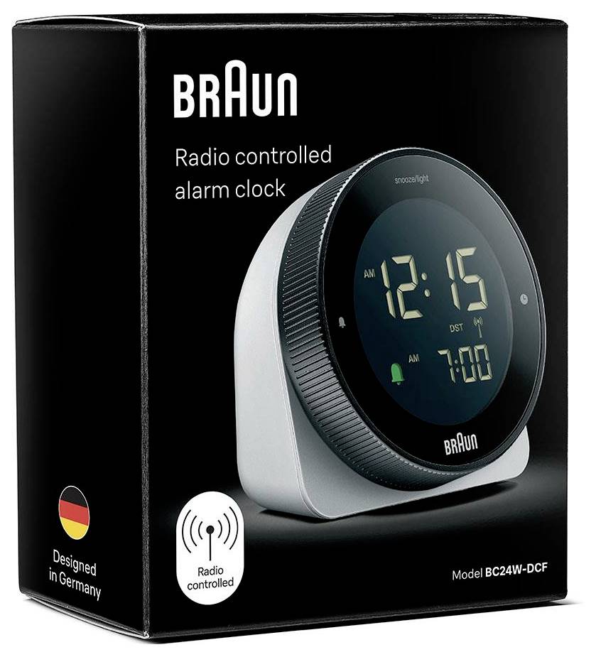 Réveil radiocommandé Braun sur boîte de produit, modèle BC24W-DCF, avec affichage numérique montrant 12:15 et 7:00.