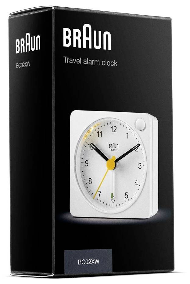 Réveil de voyage Braun blanc, présenté sur un emballage de produit noir étiqueté « BRAUN » et « BC02XW ».