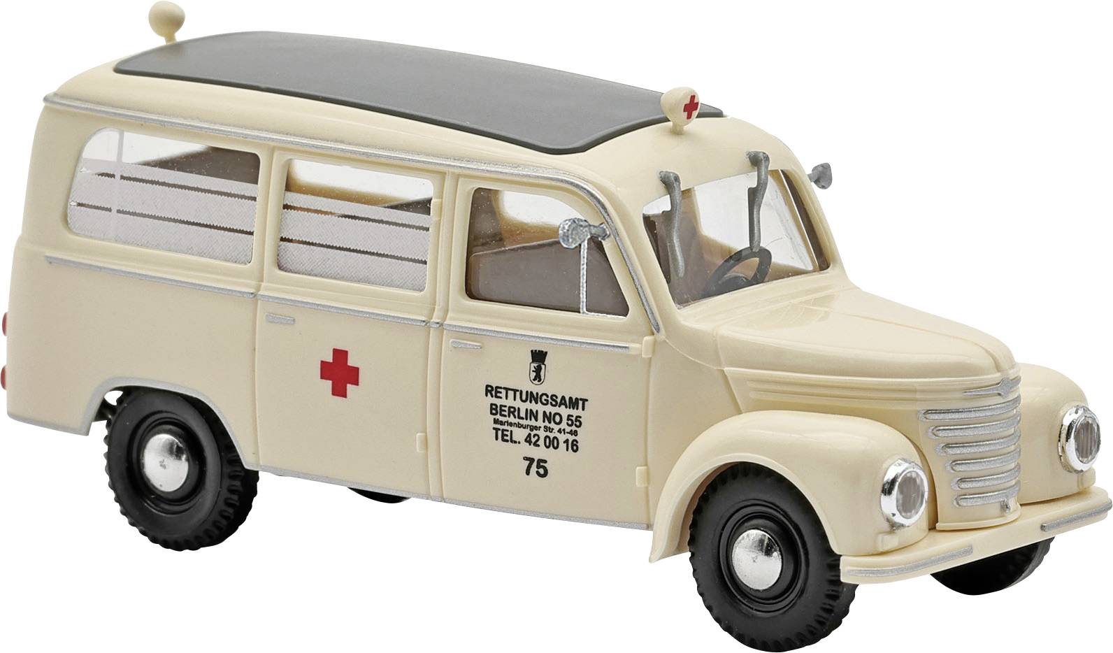 Fourgonnette ambulance modèle vintage beige avec des croix rouges et les marquages « RETTUNGSAMT BERLIN » sur le côté.