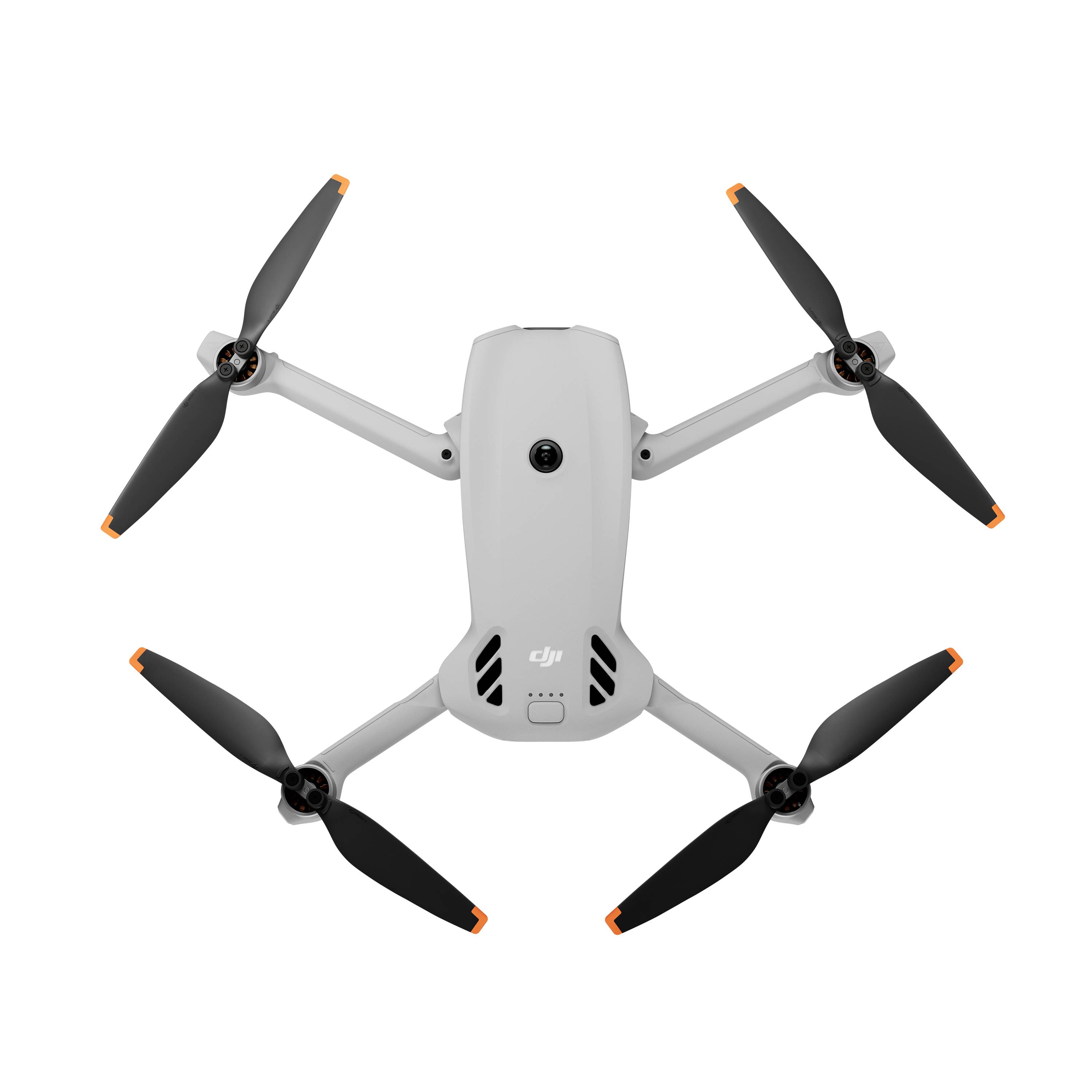 Vue de dessus d'un drone quadricoptère DJI blanc avec quatre hélices sur un fond uni.