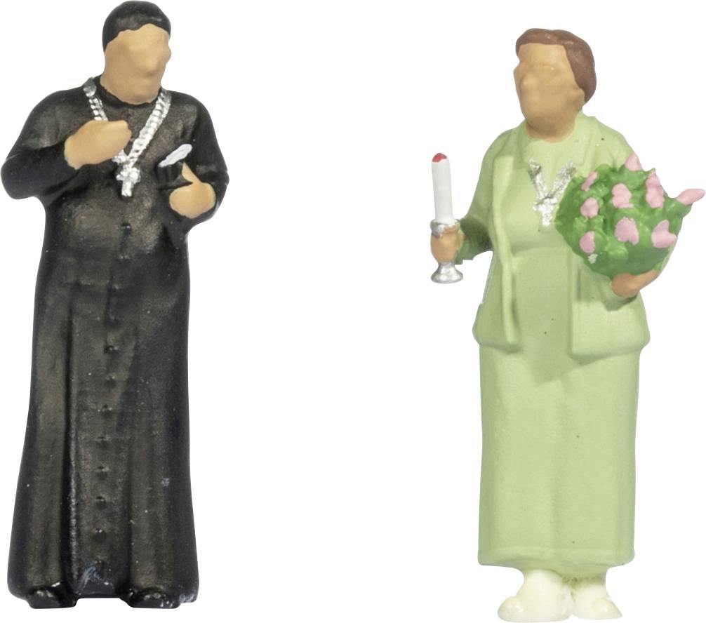 Deux petites figurines se tiennent côte à côte : une figure de clerc en robe noire avec une croix, et une femme en robe verte tenant une chandelle et un bouquet.