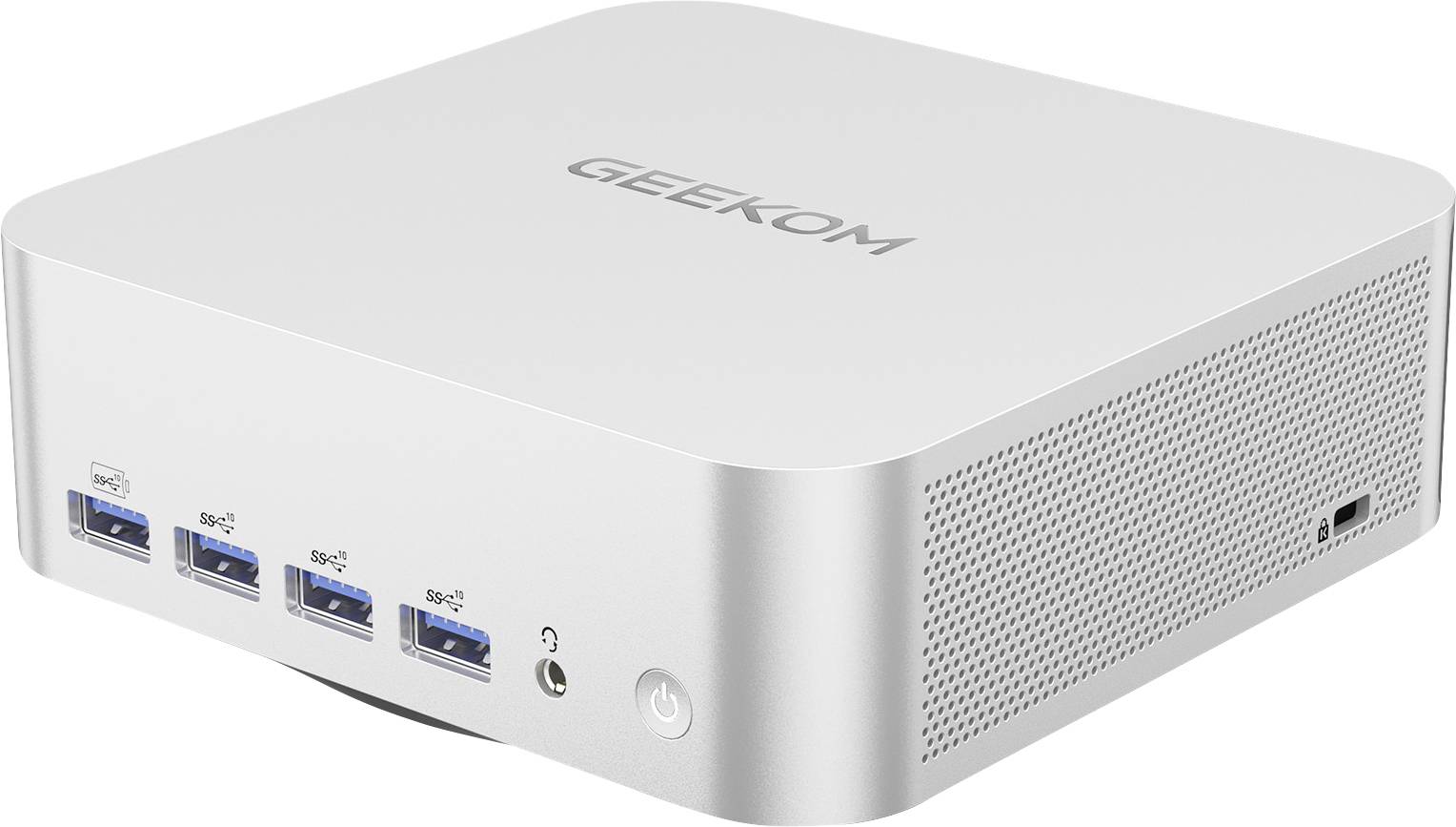 Mini PC GEEKOM en argent avec quatre ports USB avant, prise casque, bouton d'alimentation et évents latéraux perforés sur fond blanc