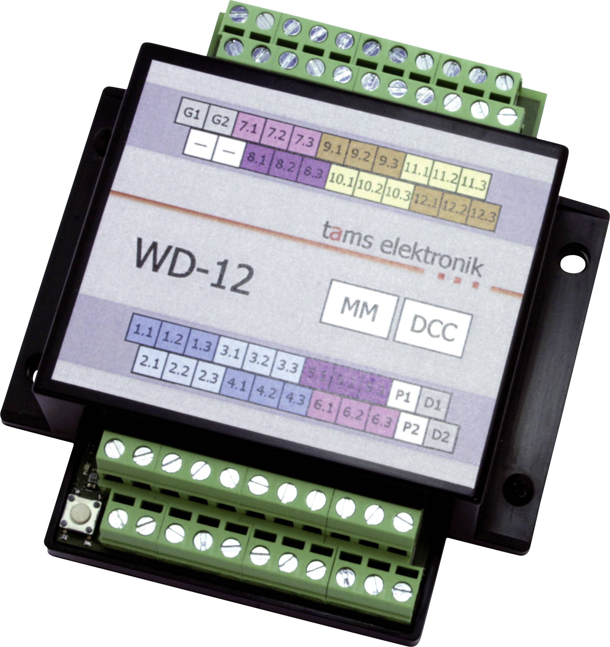 Photo d'un module de commande Tams Elektronik WD-12 avec des bornes de vis vertes et des boutons de mode MM et DCC étiquetés.