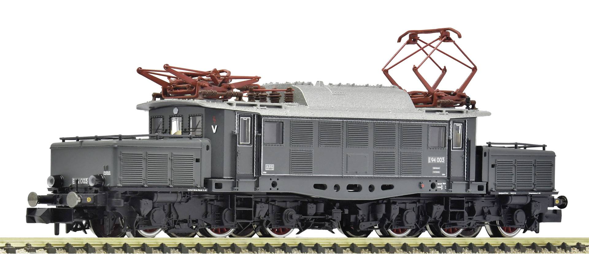 Locomotive électrique grise sur les rails, présentée en vue latérale avec les pantographes rouges relevés au-dessus du toit.