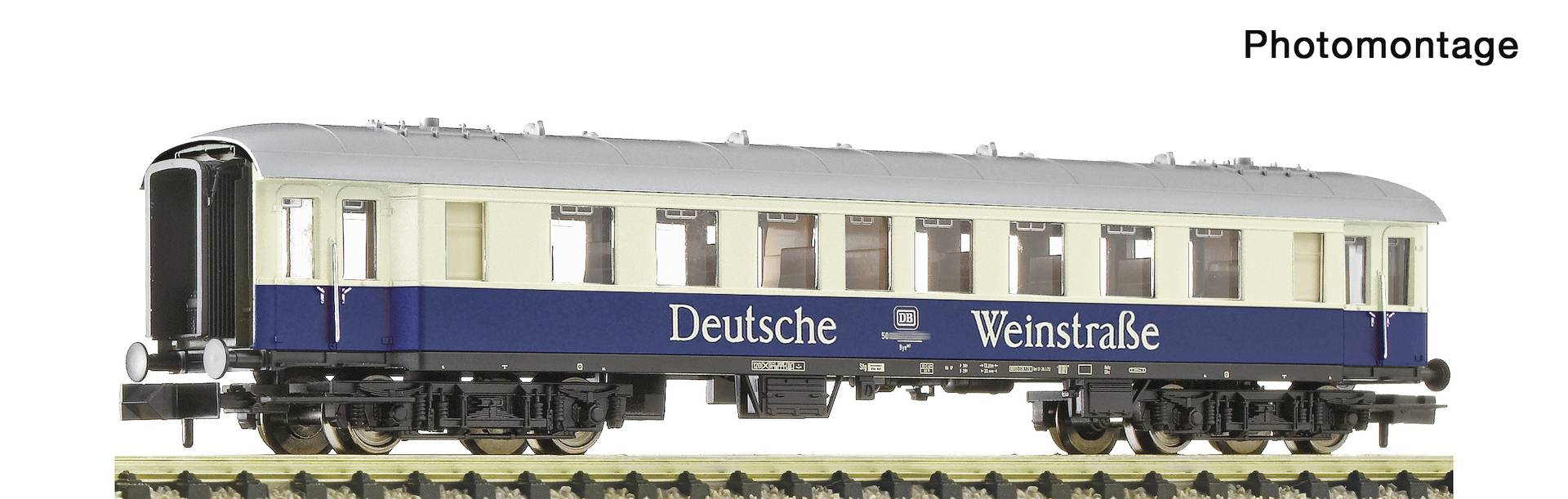 Model train passenger car labeled 'Deutsche Weinstraße' shown on tracks, photographed in side view with the title 'Photomontage' above.