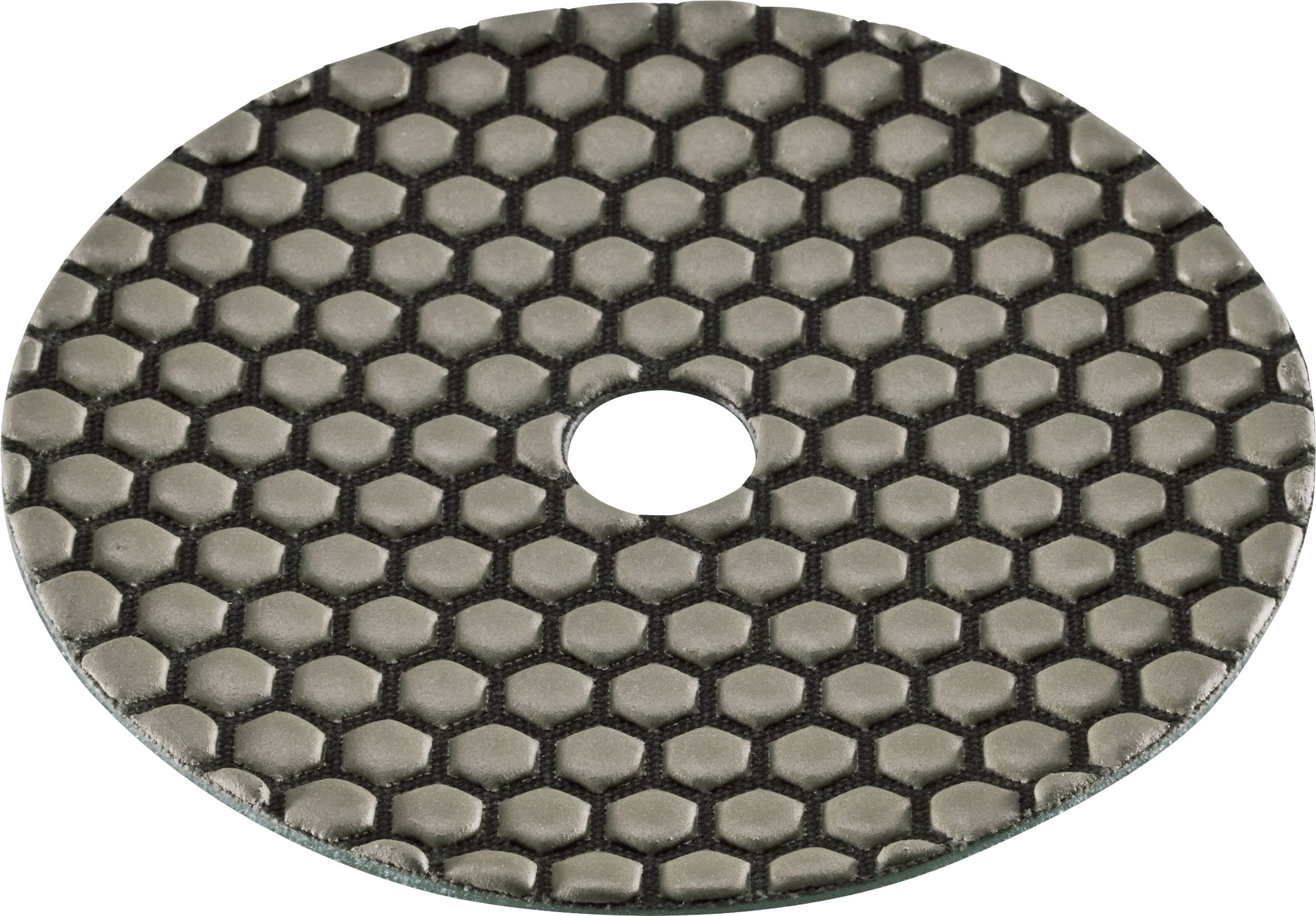 Disque métallique ovale à texture nid d'abeille avec un trou central, présenté sur un fond blanc.