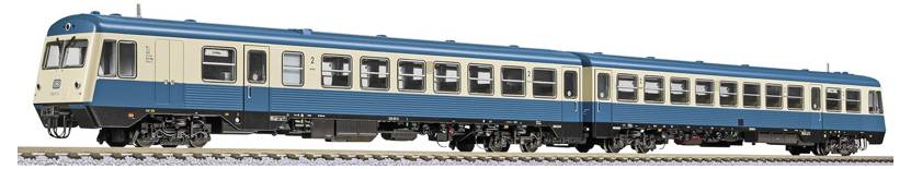 Vintage blue and cream passenger train car isolated on a white background, shown in side view.