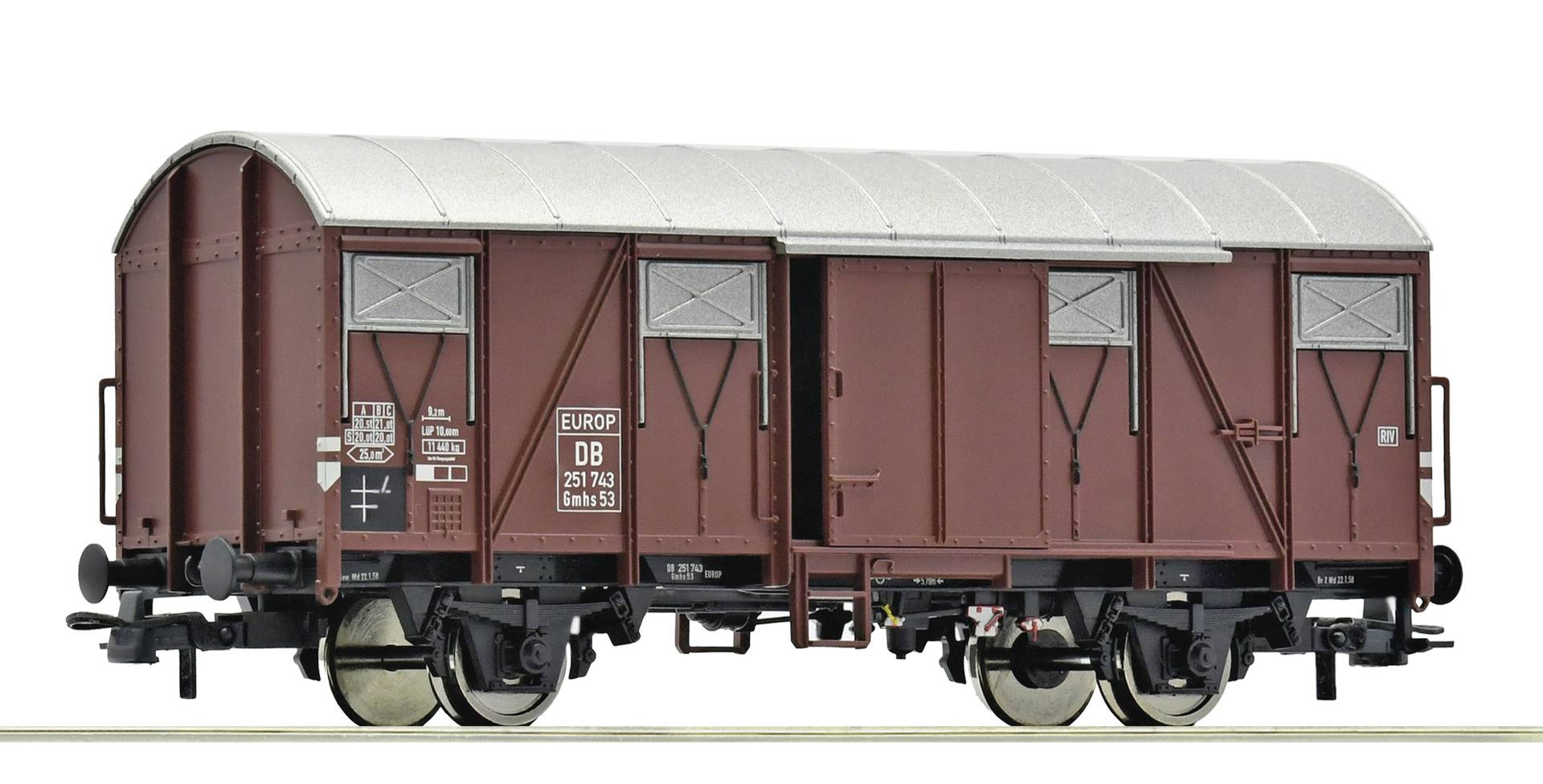 Wagon de fret marron avec un toit blanc courbe, des portes coulissantes et des roues noires présenté en vue de profil sur un fond blanc.