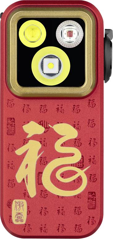 Objet décoratif rectangulaire rouge avec un panneau supérieur noir contenant trois lumières ou lentilles, présentant un grand caractère chinois doré '福' sur un fond rouge à motifs.
