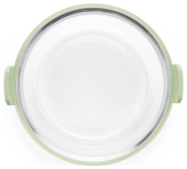 Vue de dessus d'un récipient de rangement alimentaire rond en verre vide avec un couvercle en silicone vert clair et des poignées latérales sur fond blanc