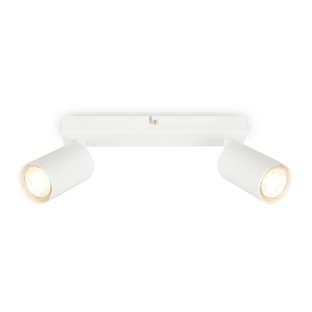 Projecteur blanc double ajustable avec deux têtes de lampe cylindriques sur un support rectangulaire, les deux luminaires orientés vers le bas.