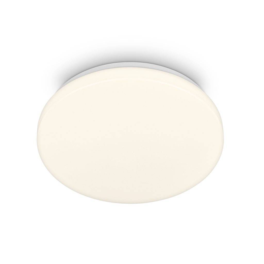 Appareil d'éclairage de plafond blanc et rond sur un fond blanc uni.