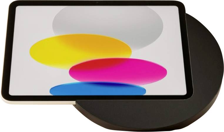 Une tablette affichant des formes ovales de couleurs superposées sur un écran blanc, partiellement sur une base circulaire noire.