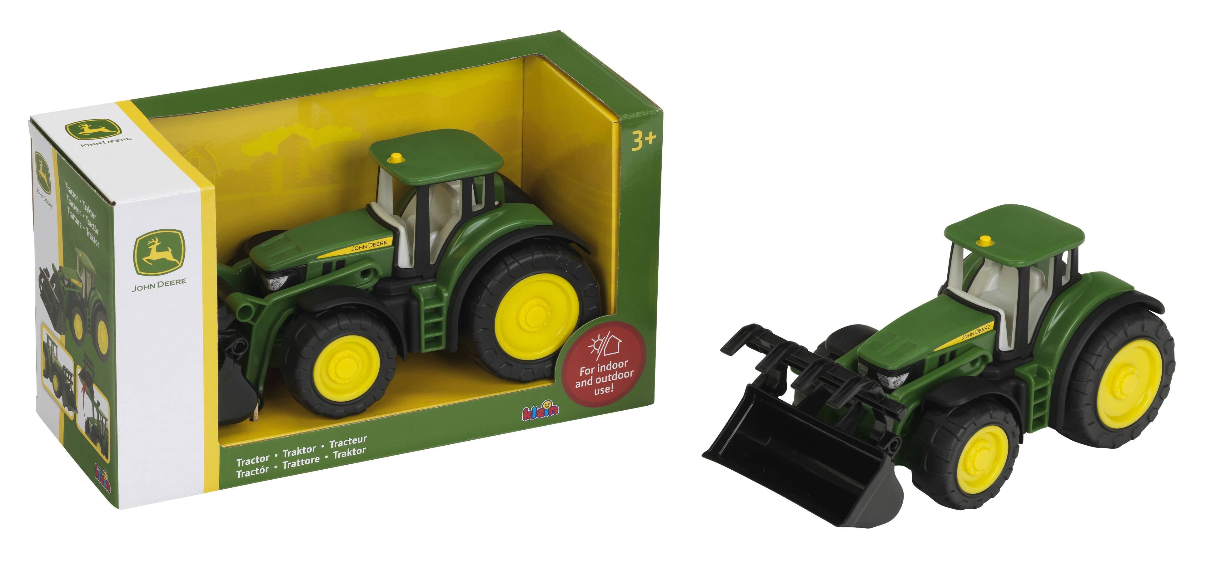 Spielzeug-Grüner John-Deere-Traktor mit Frontlader neben seiner Einzelhandelsvergäckung gezeigt.