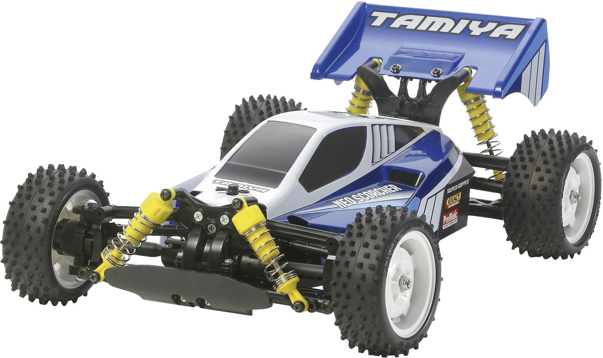 Un buggy bleu télécommandé avec de grandes roues et des amortisseurs jaunes, portant la mention 'Tamiya' sur le spoiler.