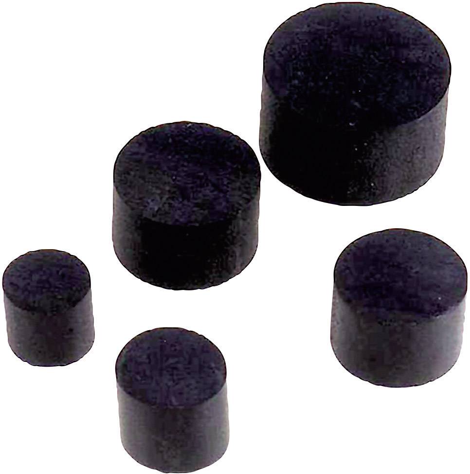 Des objets cylindriques noirs de différentes tailles sur un fond blanc, probablement des aimants ou des joints d'étanchéité.