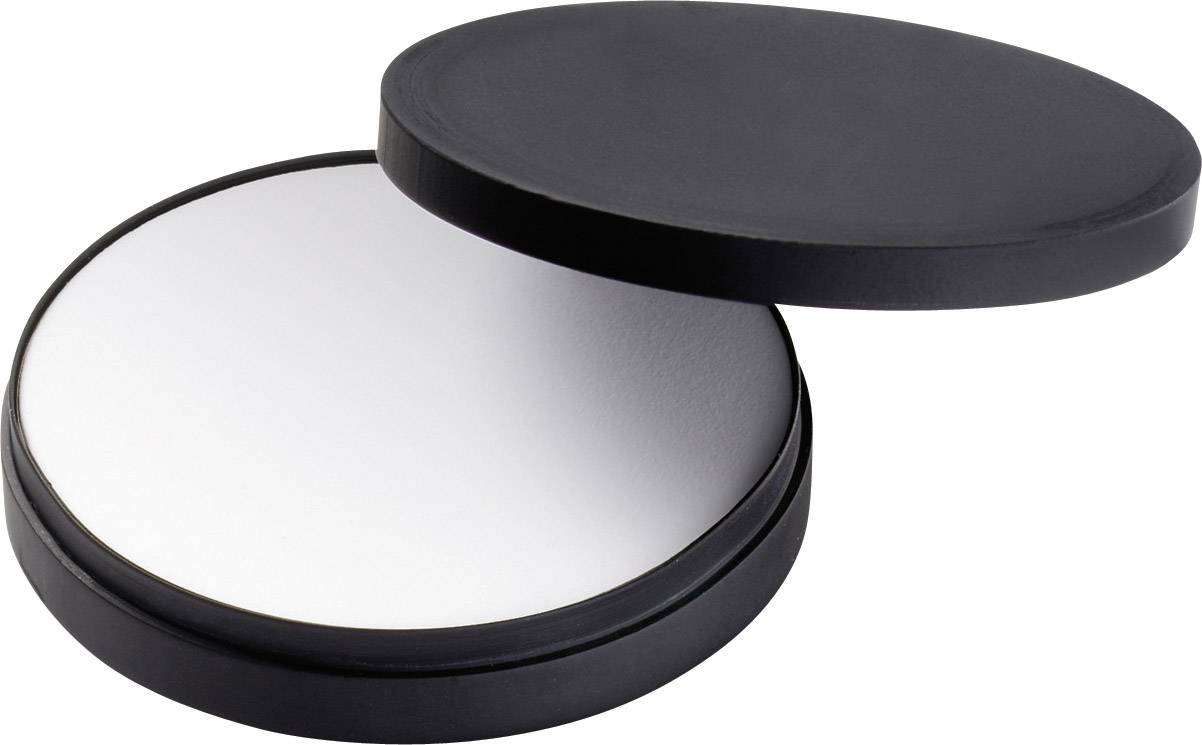 Récipient noir et rond contenant un liquide blanc, partiellement ouvert.