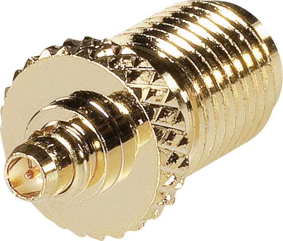 Un adaptateur doré à surface striée, servant à connecter deux interfaces différentes entre elles.