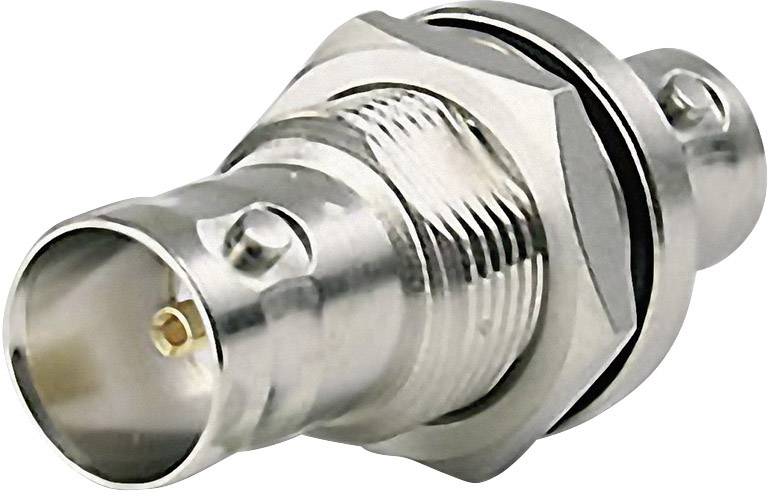 Un adaptateur coaxial métallique avec connecteur BNC, montrant une vue détaillée des connexions et des éléments de vissage.