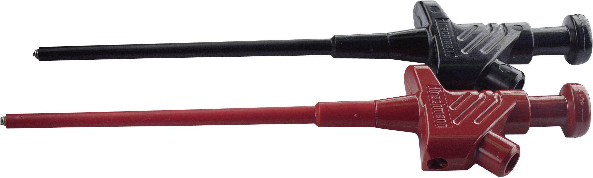 Deux aiguilles de ponction médicale, l'une noire et l'autre rouge, posées côte à côte. Elles ont des poignées en plastique et sont de longueurs différentes.