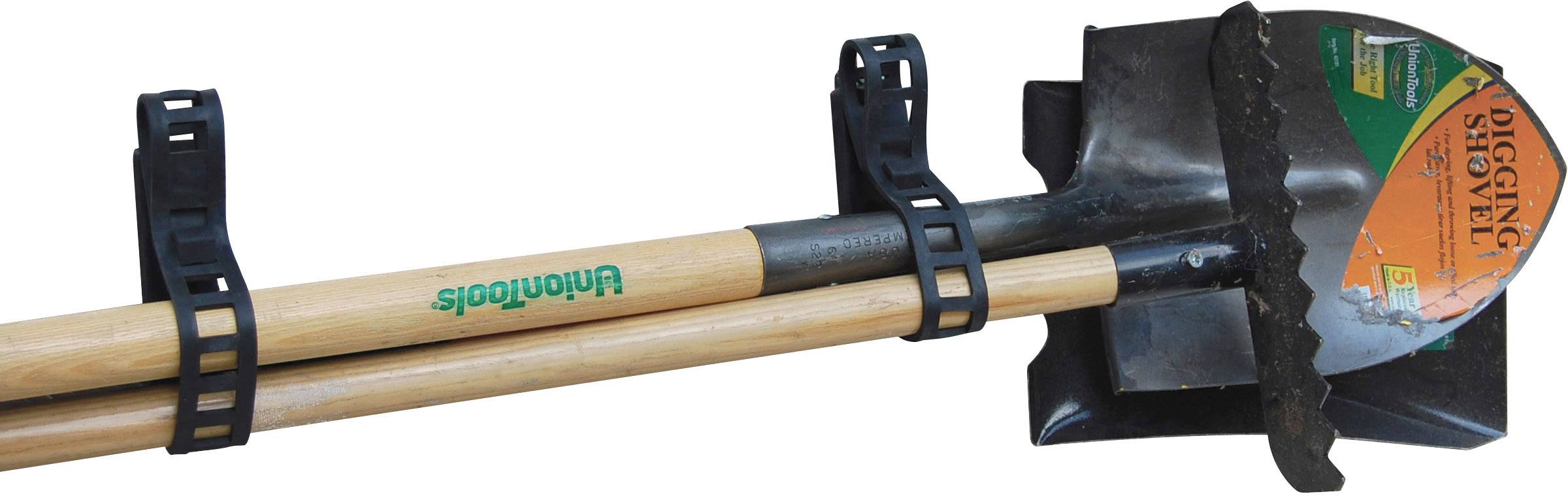 Deux outils, une pelle et un râteau, sont fixés côte à côte avec des supports noirs.