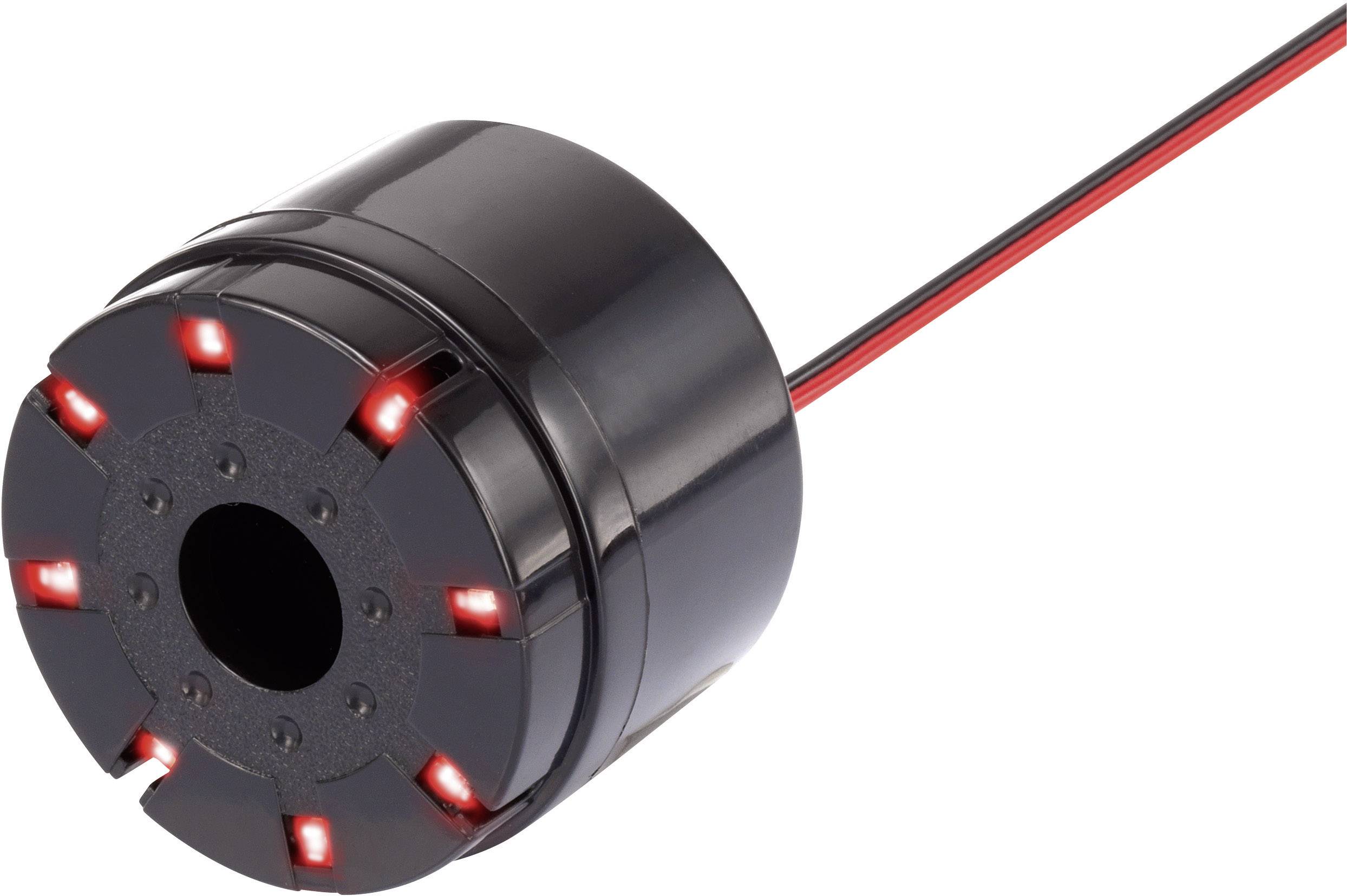 Un appareil noir cylindrique avec des lumières LED rouges sur le bord et un câble rouge et noir, probablement un capteur électronique.