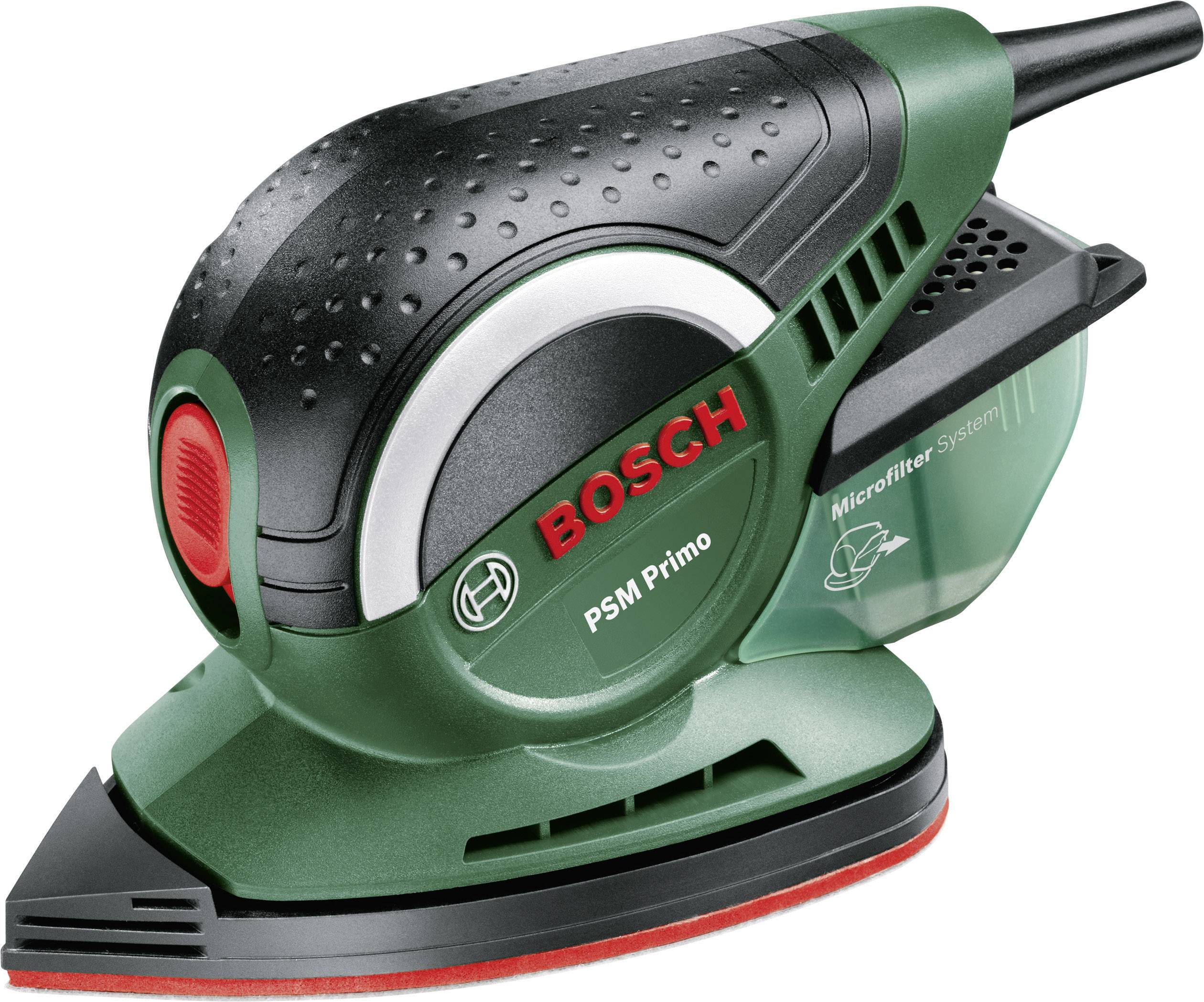 Un ponceuse multifonction Bosch PSM Primo verte avec interrupteur rouge et système de collecte des poussières.