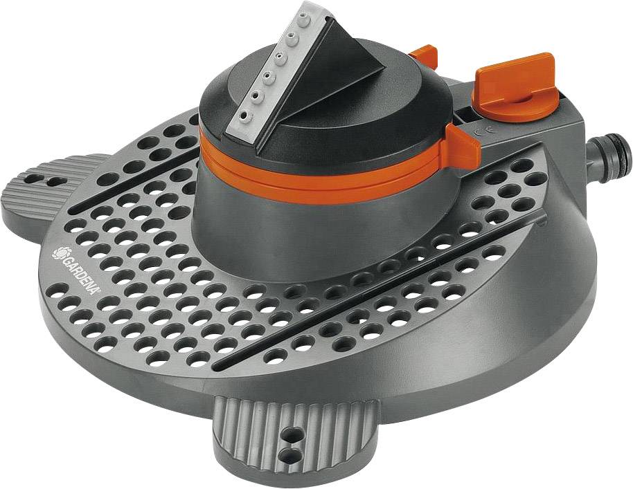 Arroseur de jardin rotatif au design noir et orange. De nombreux orifices de buses situés en haut pour une distribution uniforme de l'eau. Adapté à l'irrigation des pelouses.