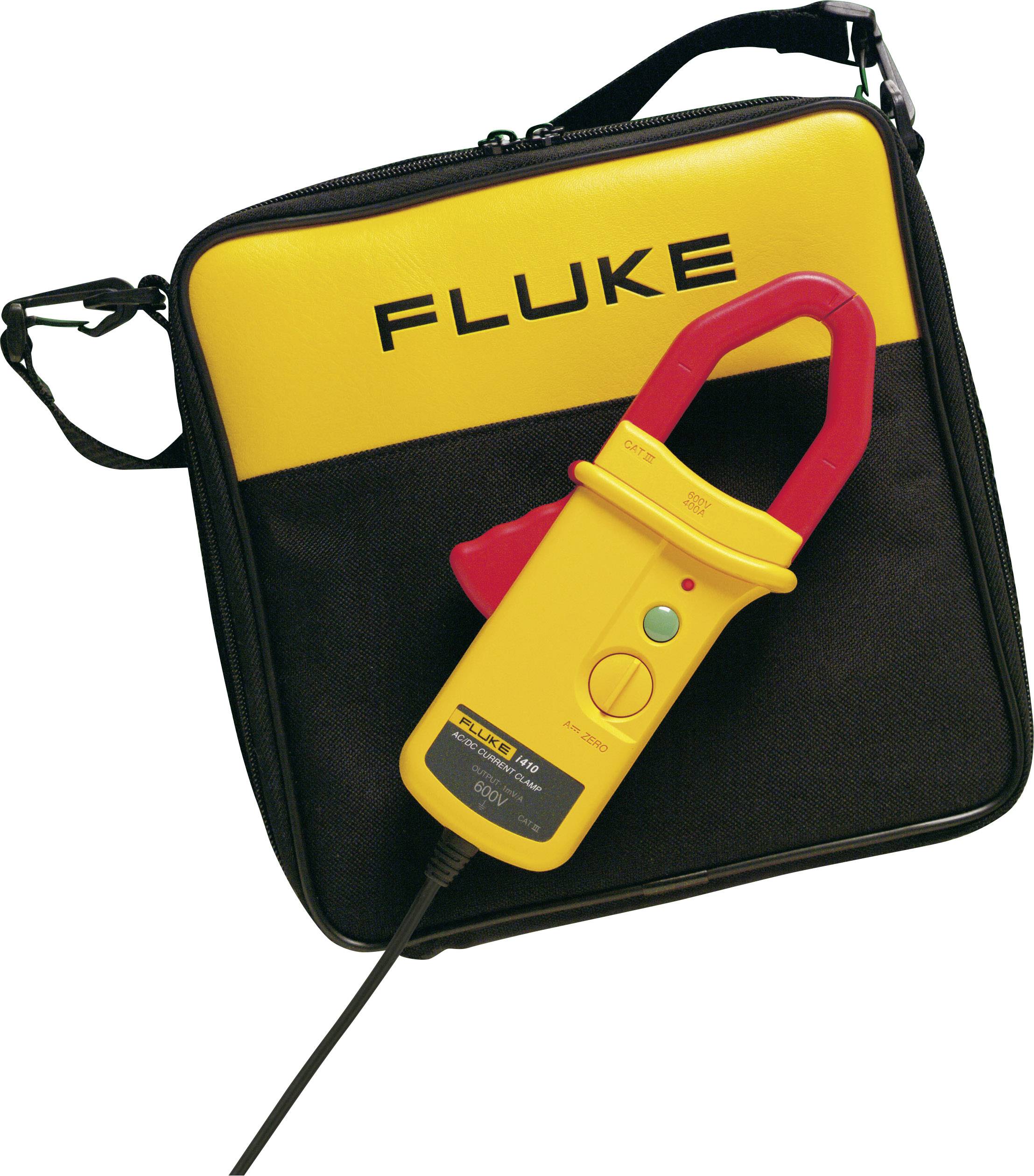 Un multimètre à pinces jaune et rouge de Fluke, posé sur un étui de transport noir avec le logo jaune de Fluke.