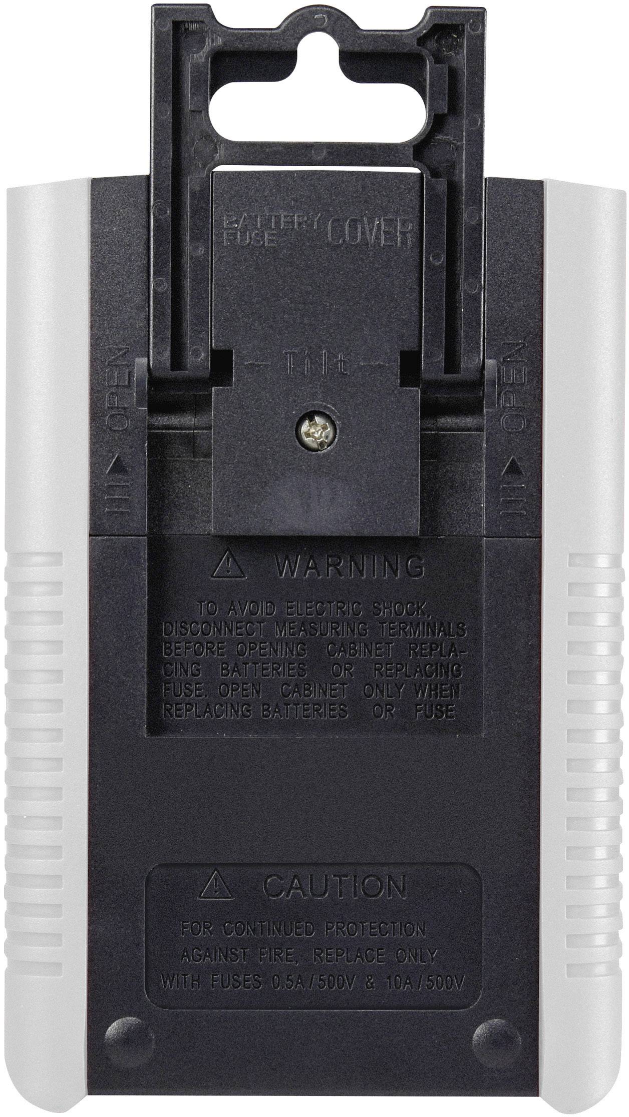 Verso d'un appareil portable avec des avertissements et un couvercle de compartiment à fusibles. Une vis au centre sécurise le couvercle.