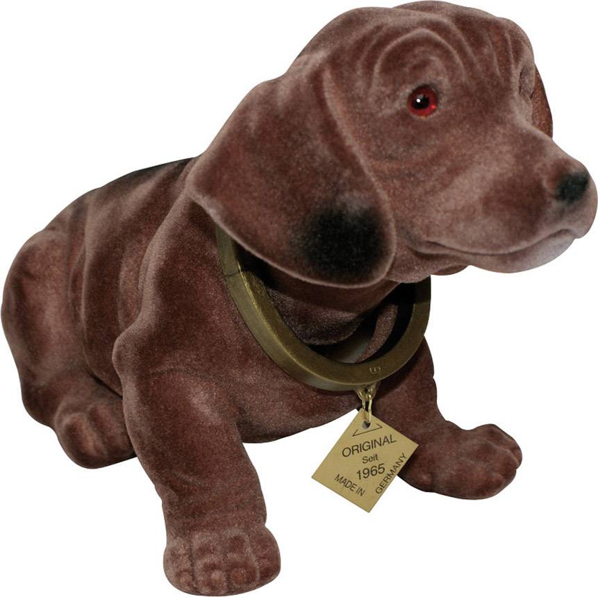 Un teckel en peluche marron avec des yeux rouges porte un panneau indiquant 'Original depuis 1965' autour du cou.