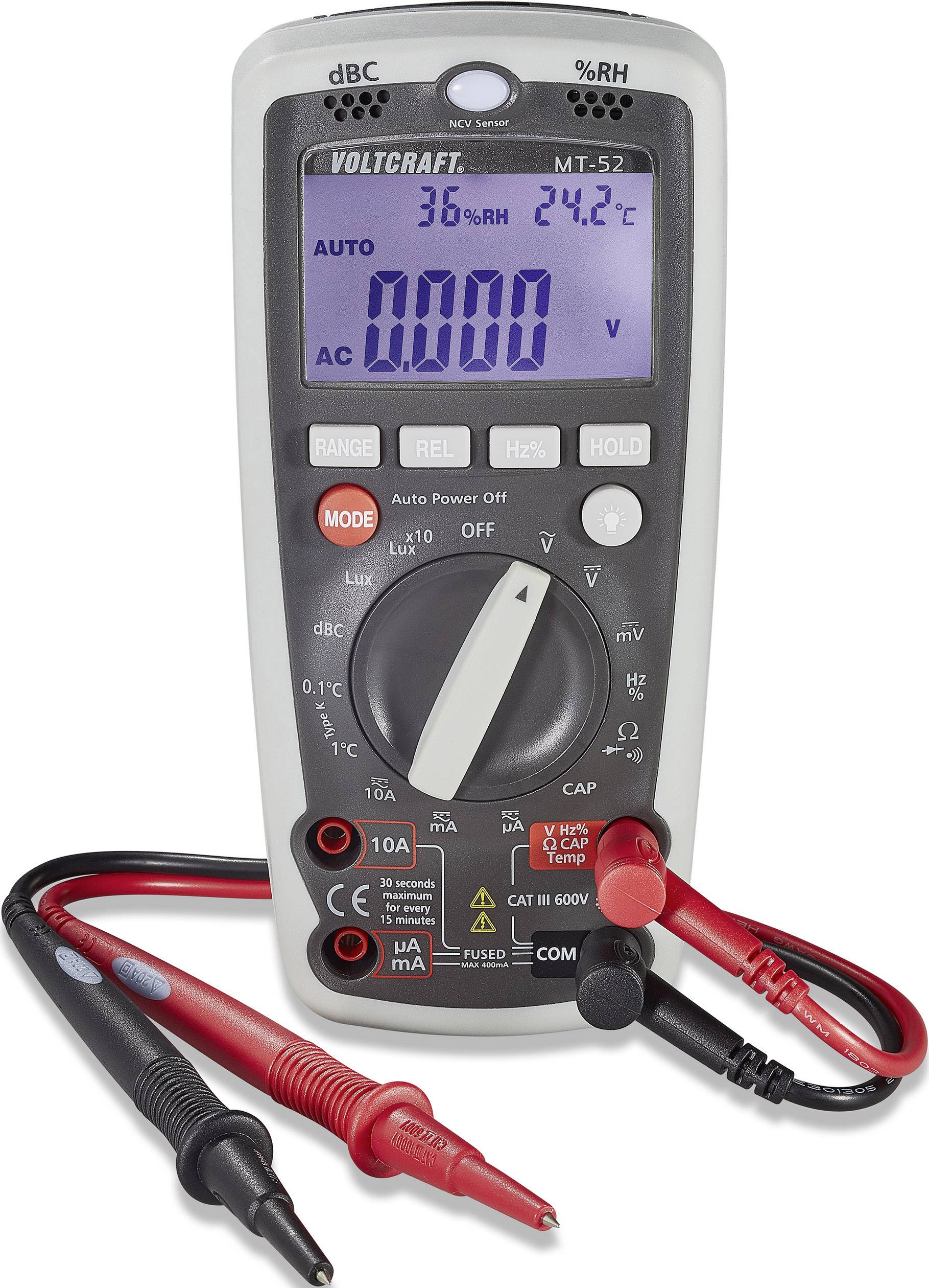 Multimètre électronique avec affichage numérique, commutateur pour modes de mesure et cordons de test rouge et noir, utilisé pour les mesures de tension.