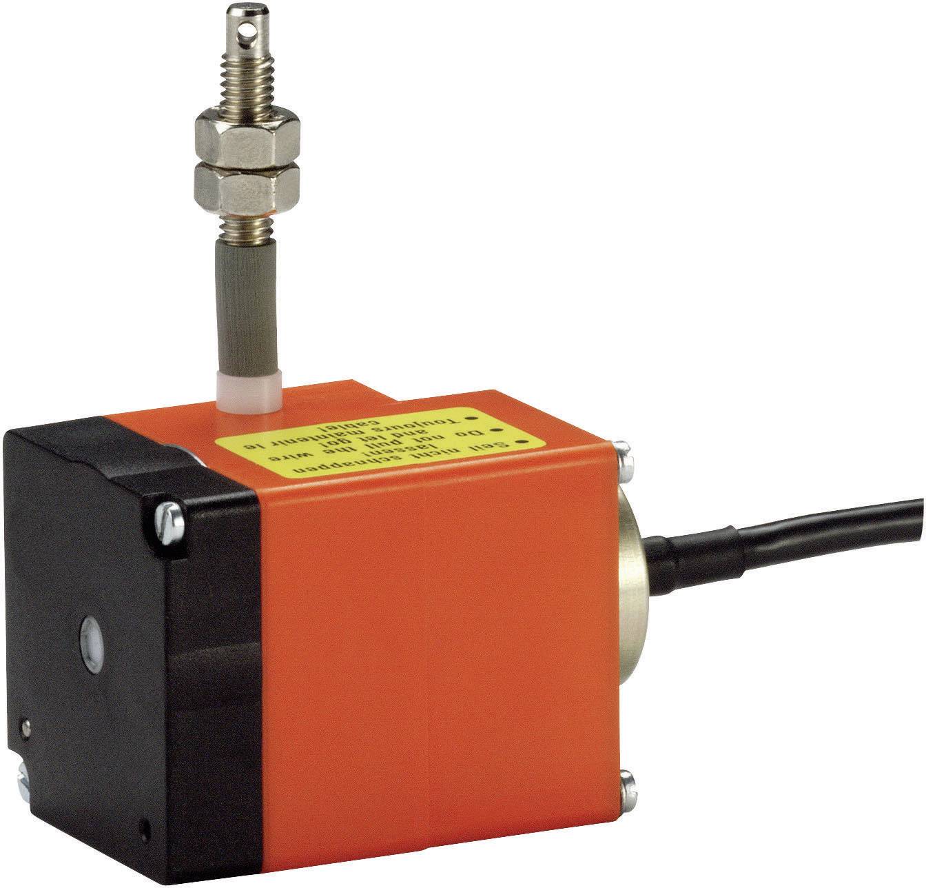 Un appareil électrique rouge en forme de cube, avec un connecteur et un câble noir, ainsi qu'une connexion à vis métallique sur le dessus.