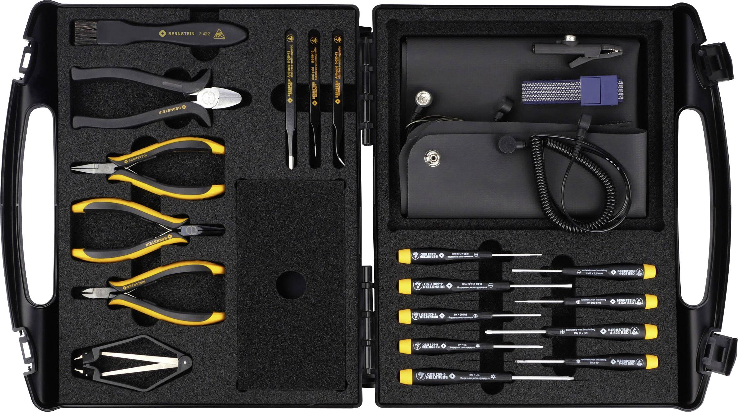 Une boîte à outils ouverte contenant différentes pinces, tournevis et pinces, tous soigneusement rangés dans un compartiment matelassé.