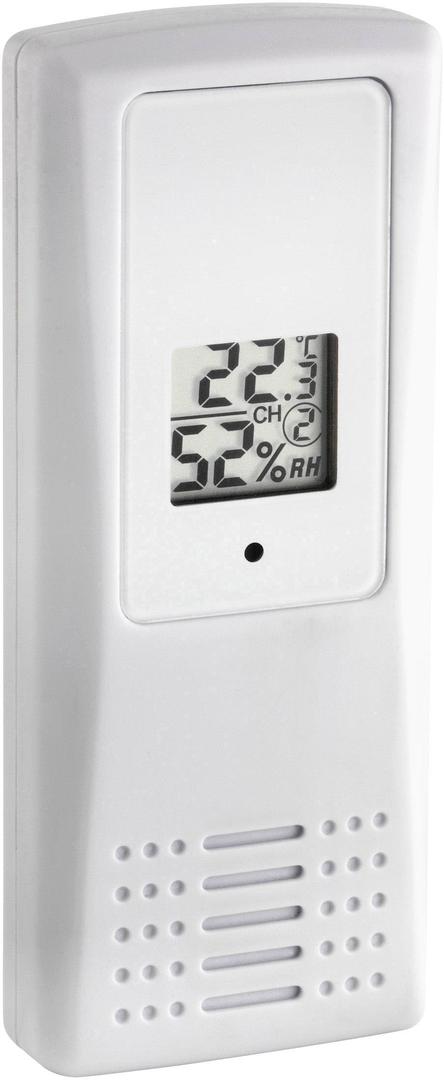 Un hygromètre numérique blanc affiche '22°C' et '52% HR'.