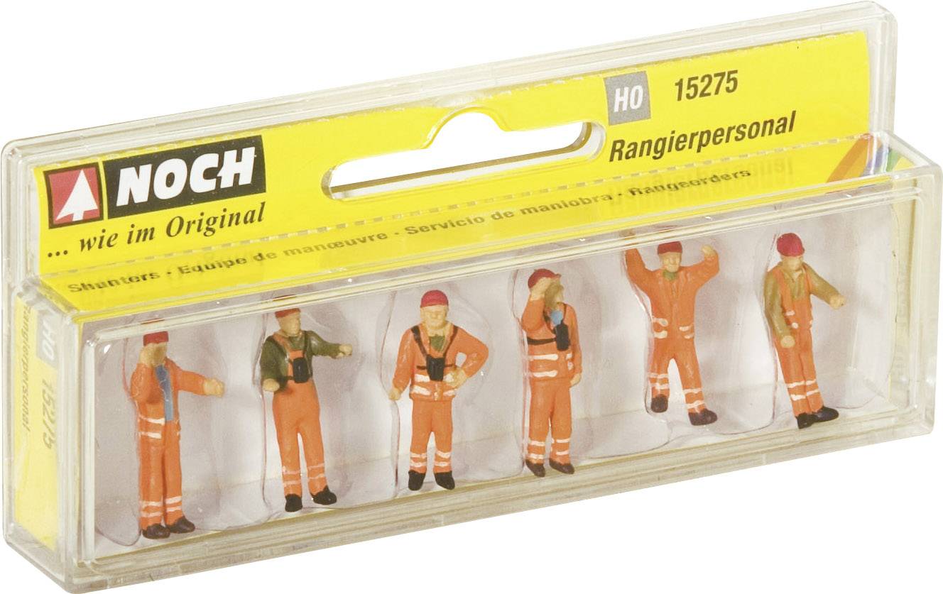 Cinq personnages miniatures en tenue de sécurité orange dans un emballage en plastique. Étiquette : « Personnel de manœuvre HO 15275 ».