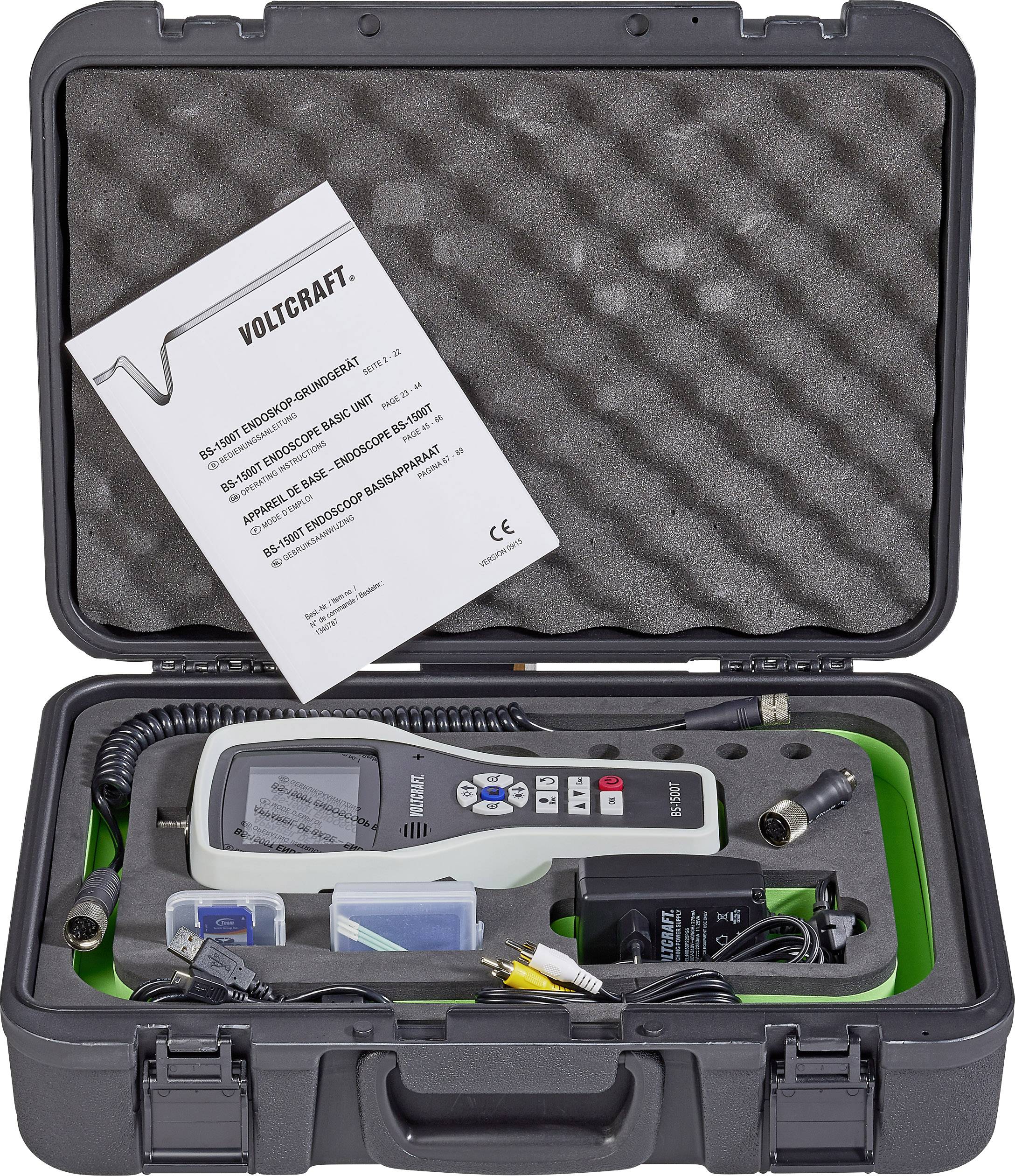 Multimètre portable VOLTCRAFT dans un coffret rigide avec accessoires et mode d'emploi. L'appareil affiche les données de mesure sur l'écran.