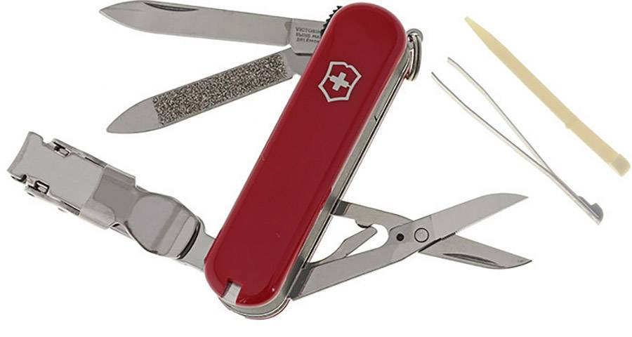 Couteau de poche avec des plaquettes de manche rouges et plusieurs outils dépliés, dont un couteau, une lime, des ciseaux et une pince.